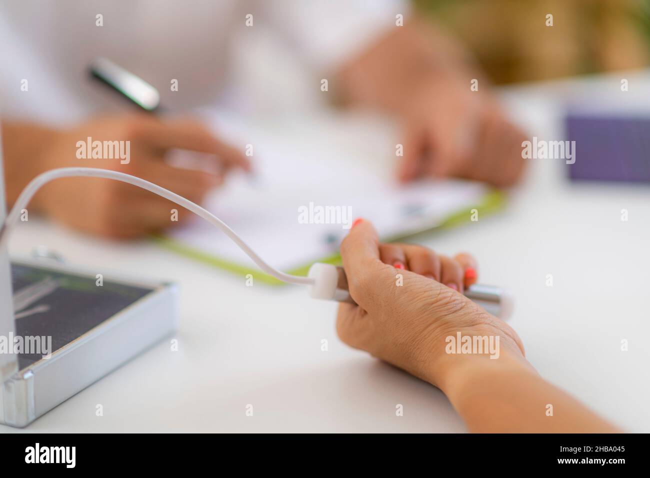 Quantum medicine, conceptual image. Woman undergoing quantum analysis