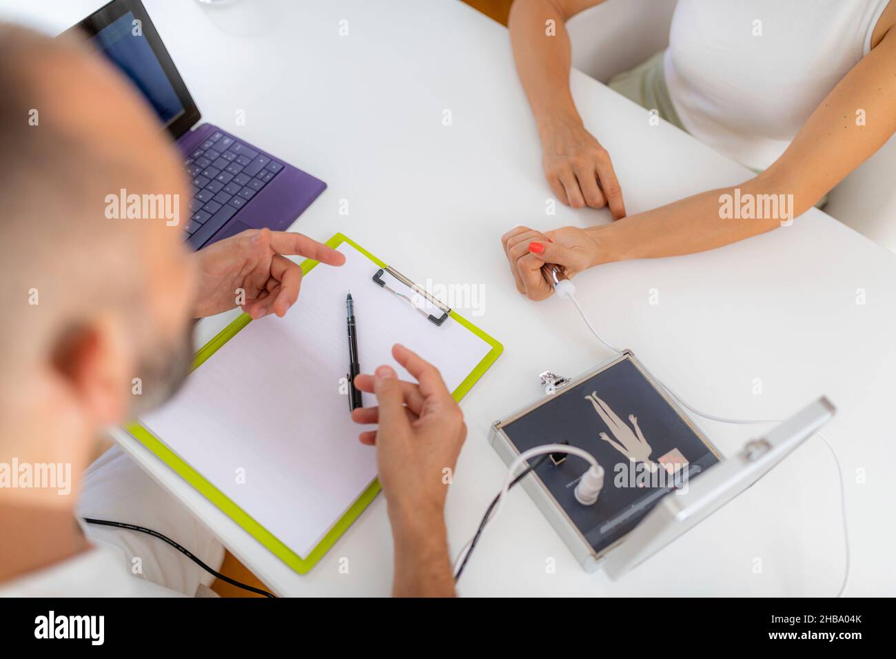 Quantum medicine diagnostics. Doctor or a practitioner explaining