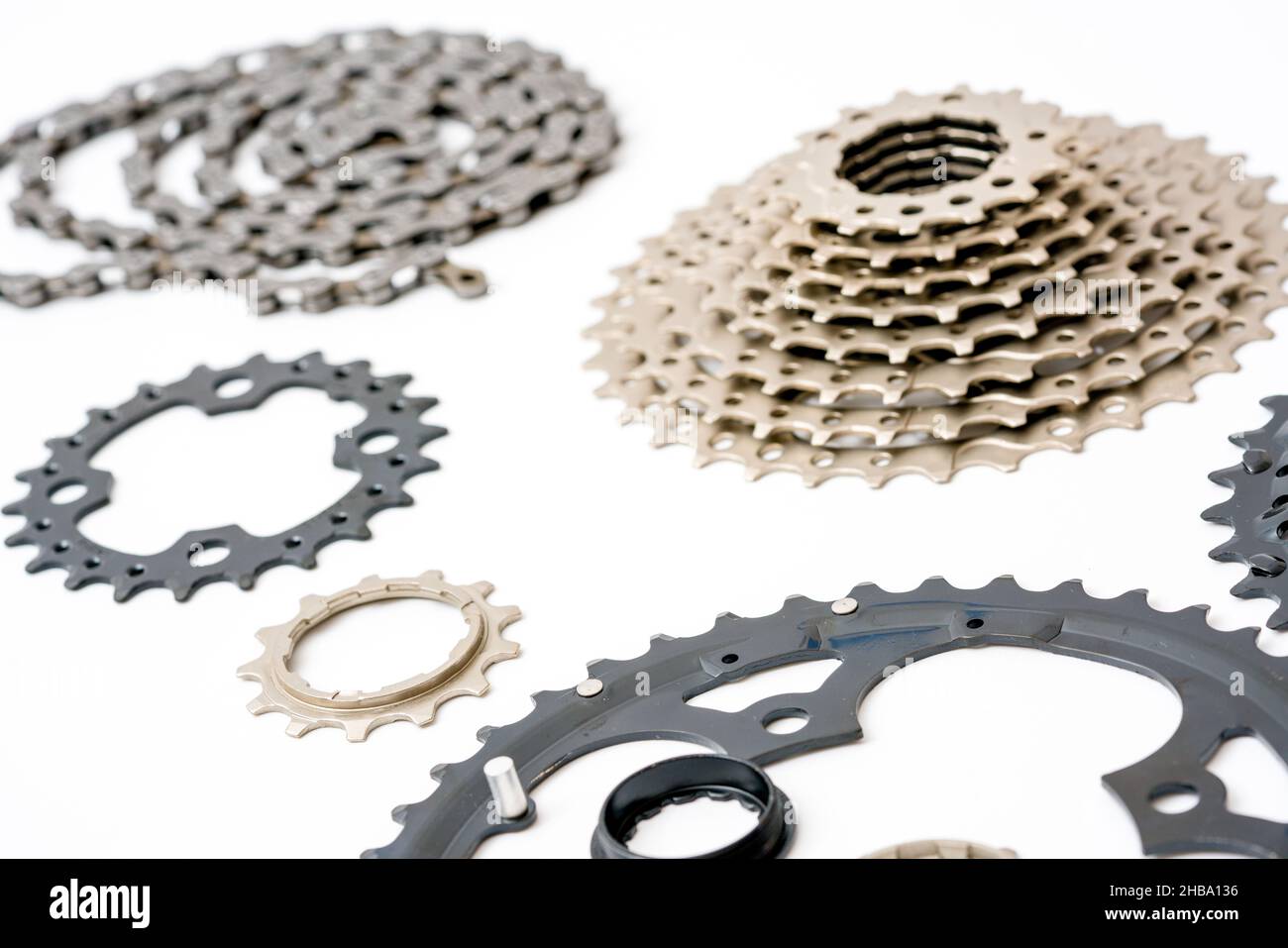 Gears, sprockets and chain of a mountain sports bike on a white