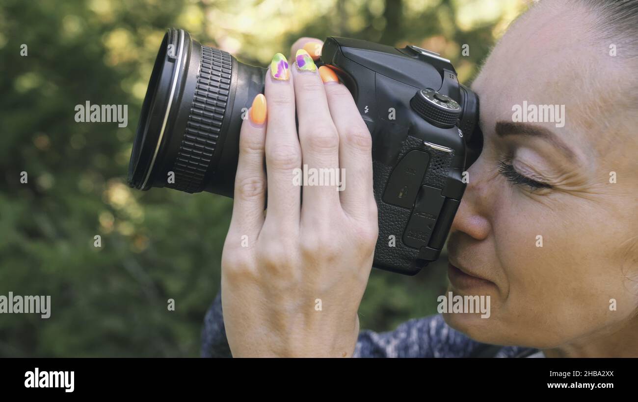 traveler-photographing-scenic-view-in-forest-one-caucasian-woman