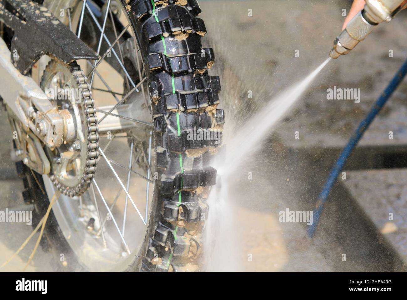 Washing Dirt out of motorcross Bike Stock Photo Alamy