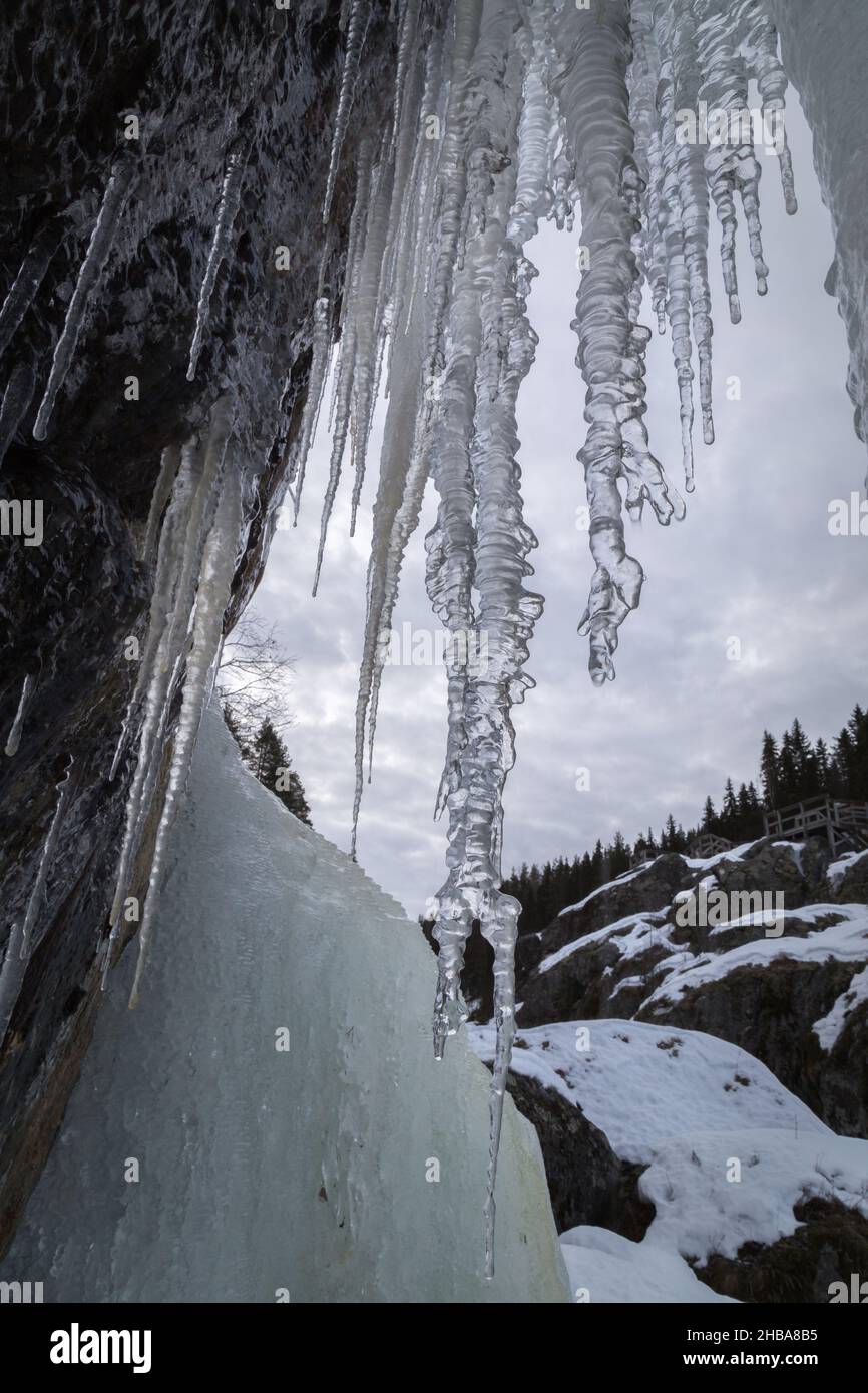 icicles melting hanging in a mountain winter landscape Stock Photo