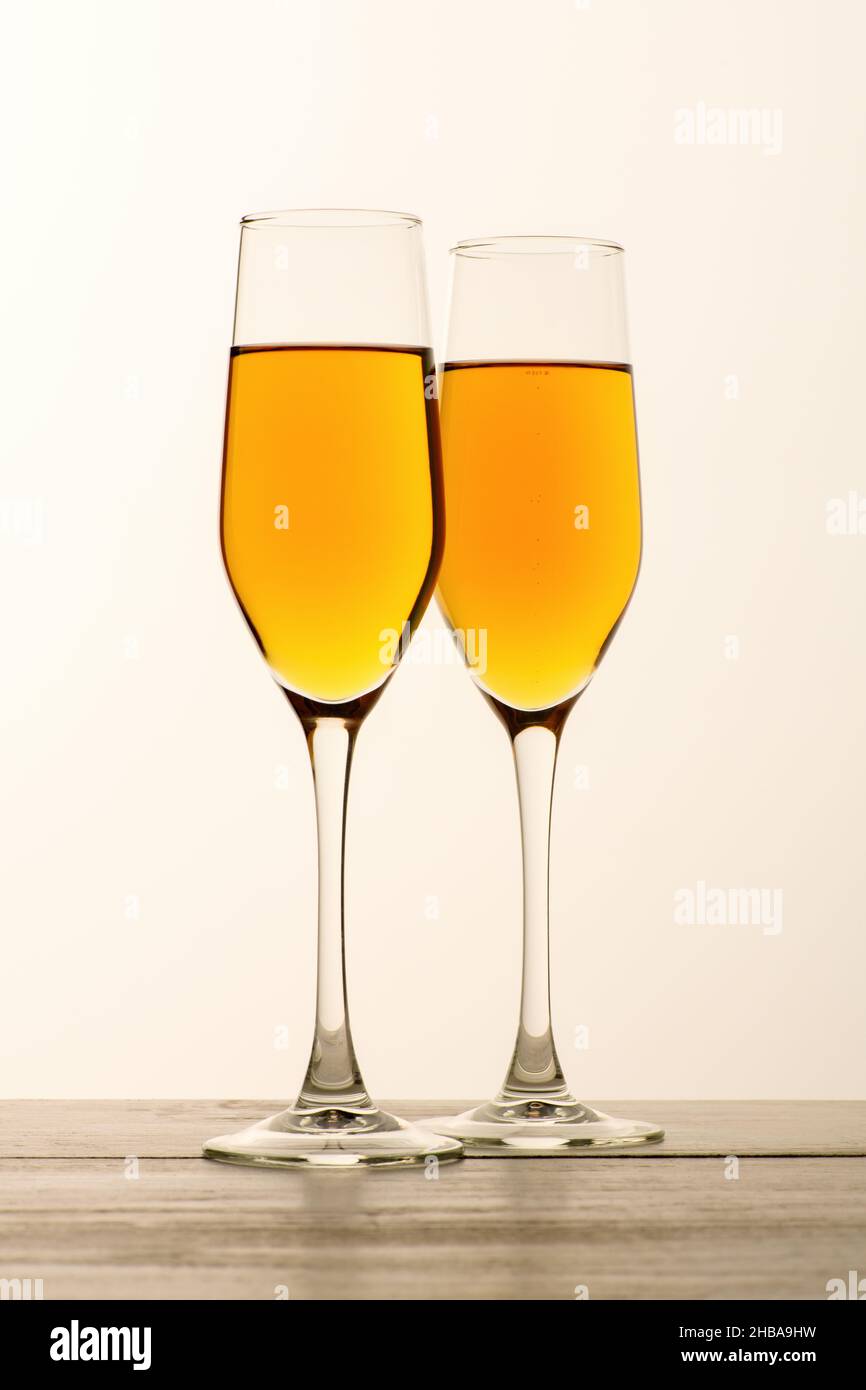 Two glasses of champagne, wine on gray background. Alcoholic drink: champagne, beer, white wine. New year and Christmas background. Valentine's Day. V Stock Photo