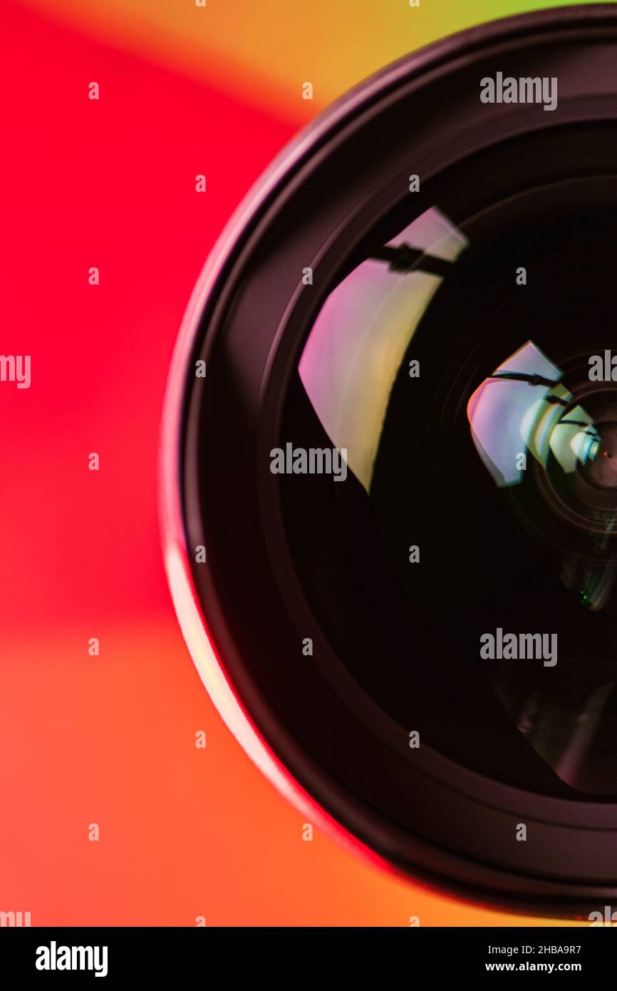 The camera lens and the beautiful light orange color. The orange rays