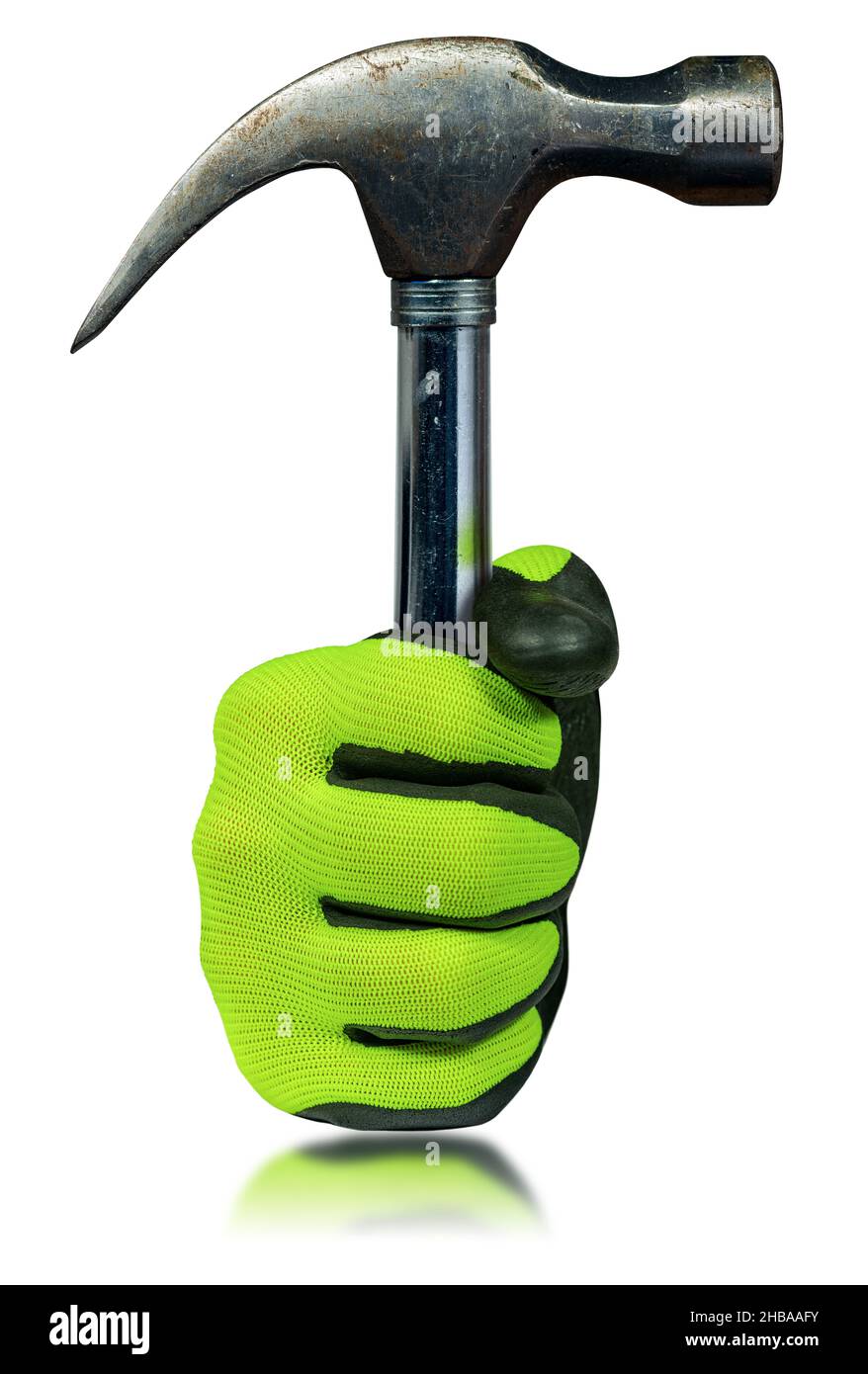 Hand with green and black protective work glove holding an old steel claw hammer. Isolated on white background with reflections. Stock Photo
