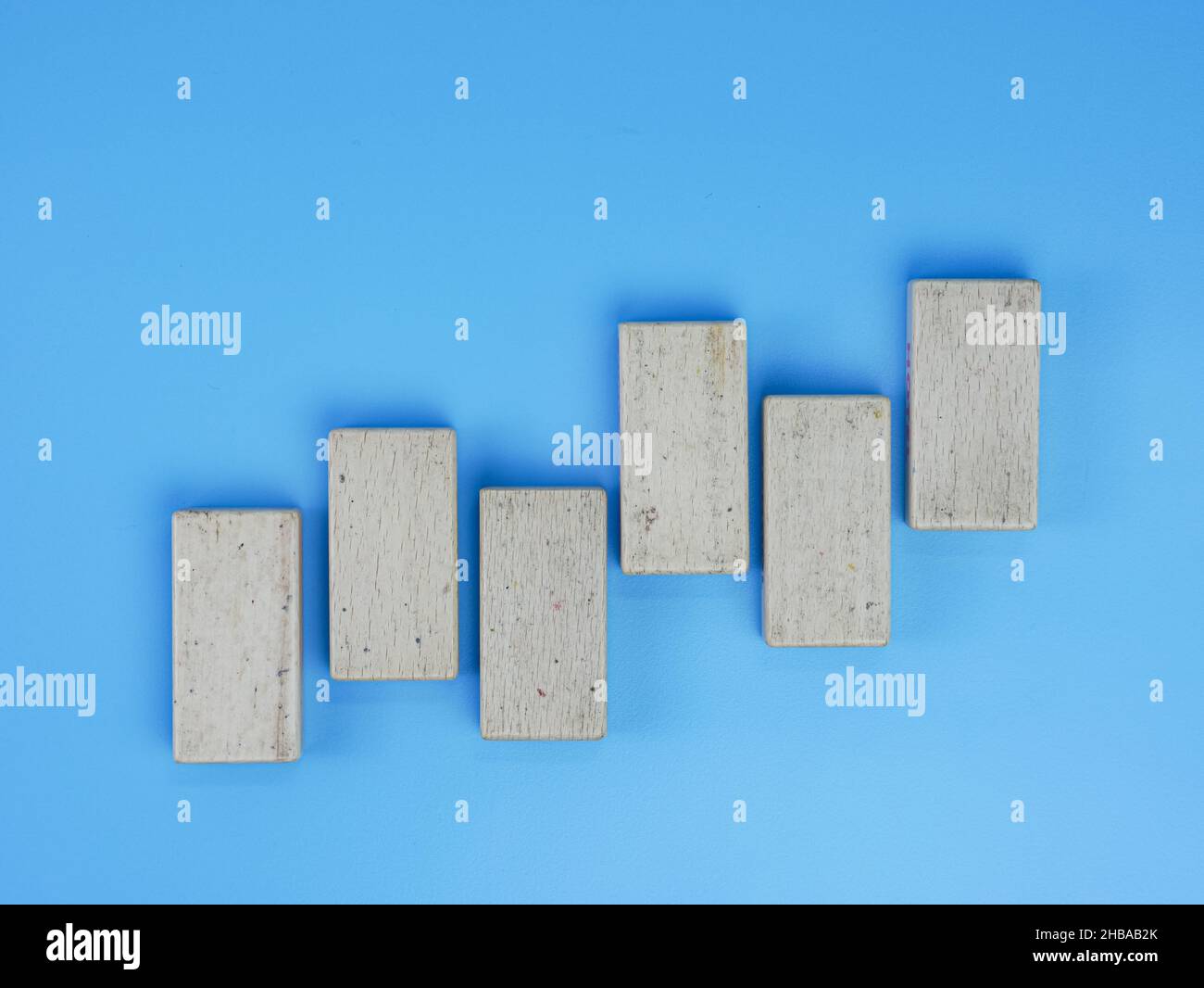 business up and down chart concept, wooden block isolated on blue ...