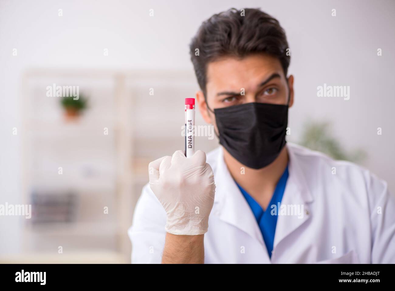Young biochemist testing blood samples Stock Photo