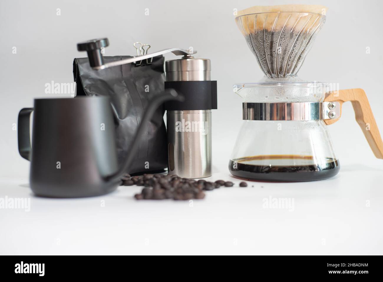 Drip brewing coffee on paper filtered pouring water over roasted with