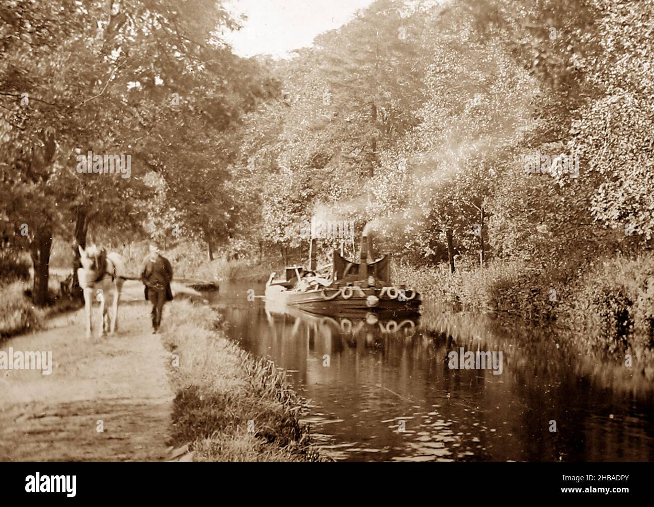 Horse feeding while pulling a canal barge, Victorian period Stock Photo