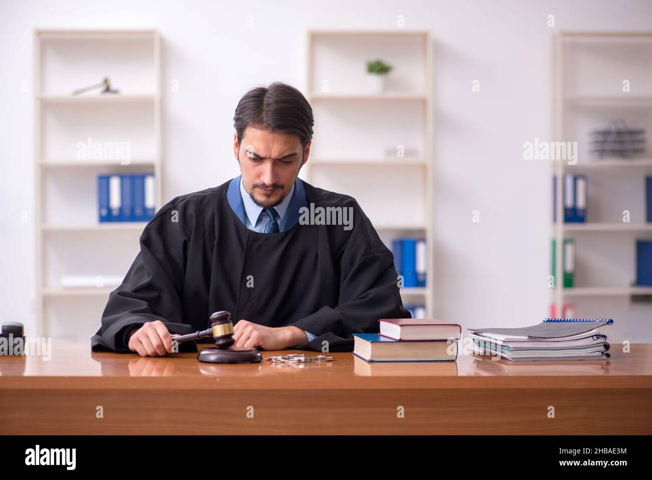 Judge Example Young judge working in the courtroom Stock Photo - Alamy