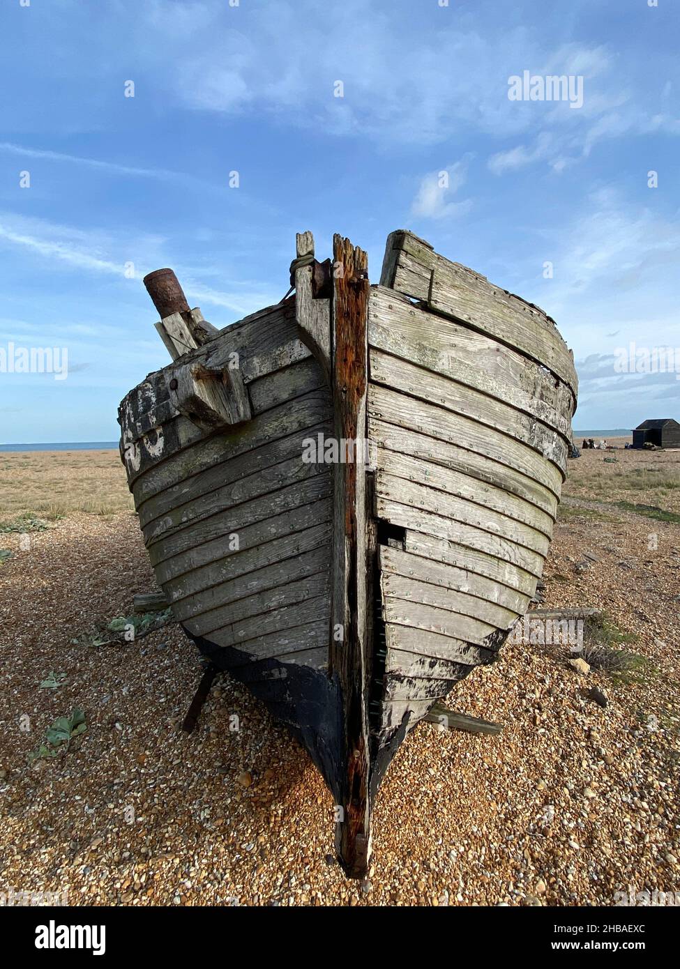 old boat hull wreck wooden and worn boat hull background on beach Stock ...