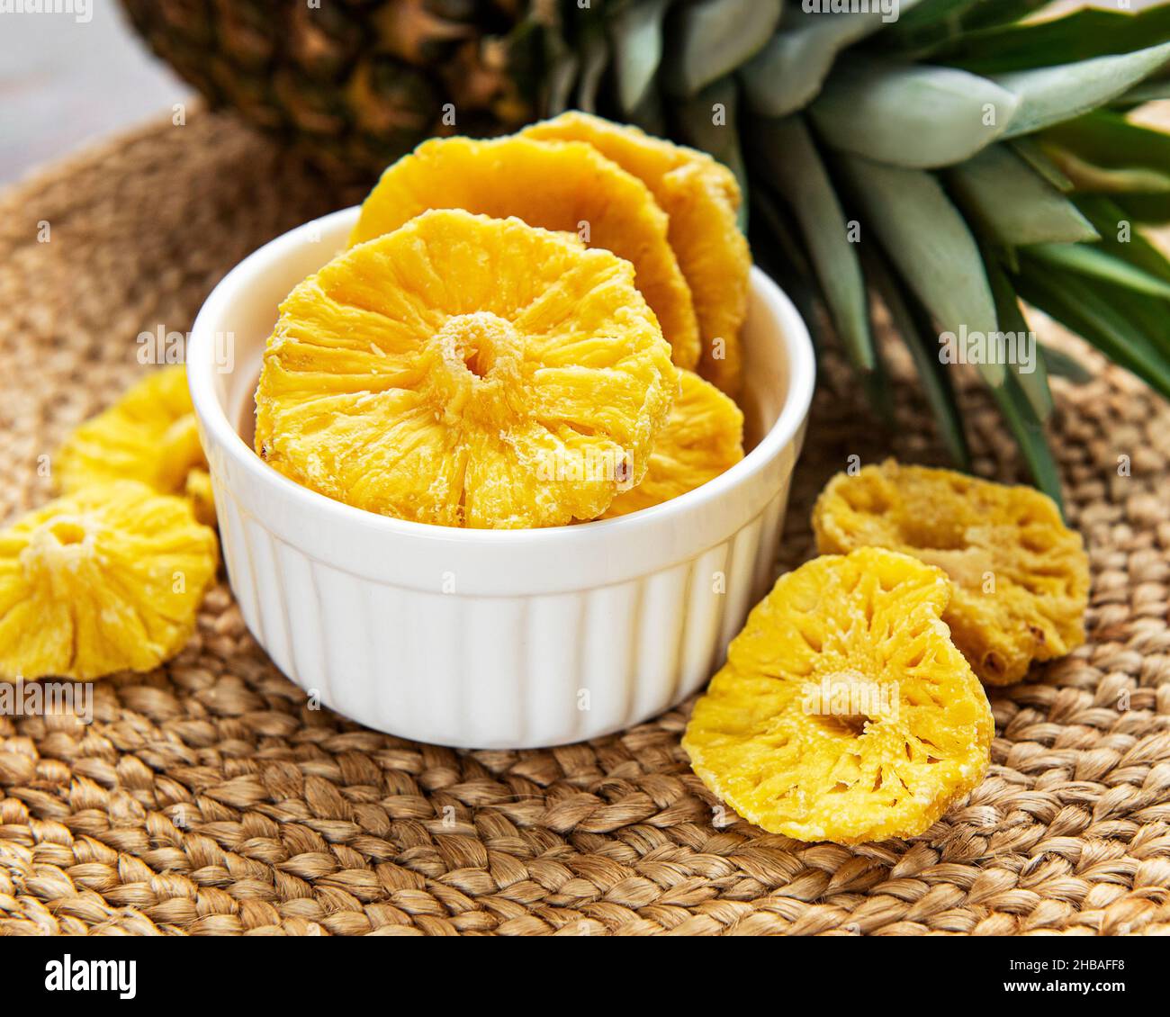 Pineapple dried rings on a rustic background Stock Photo