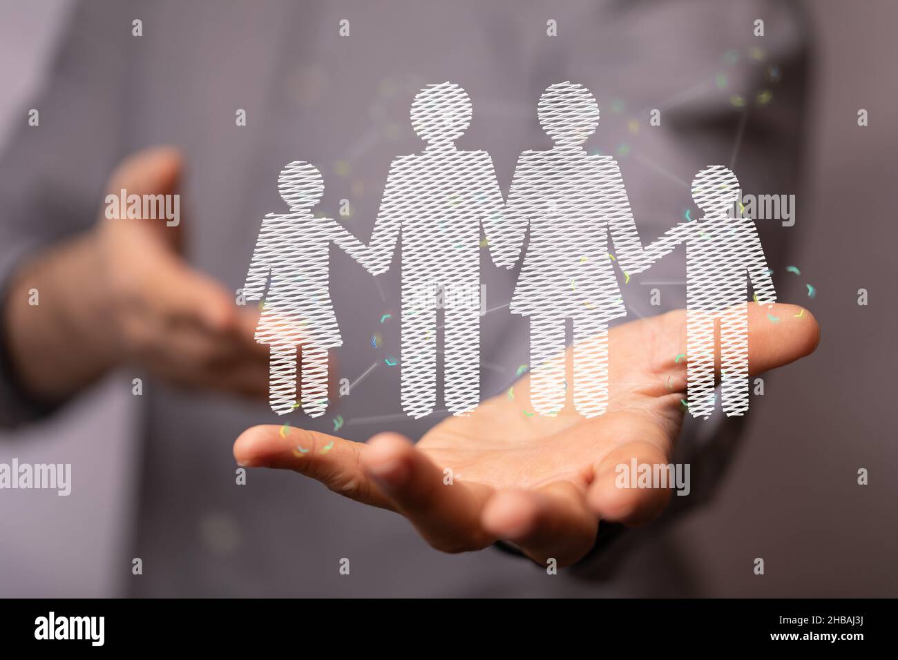3d rendered family members hovering over a man's hand Stock Photo - Alamy
