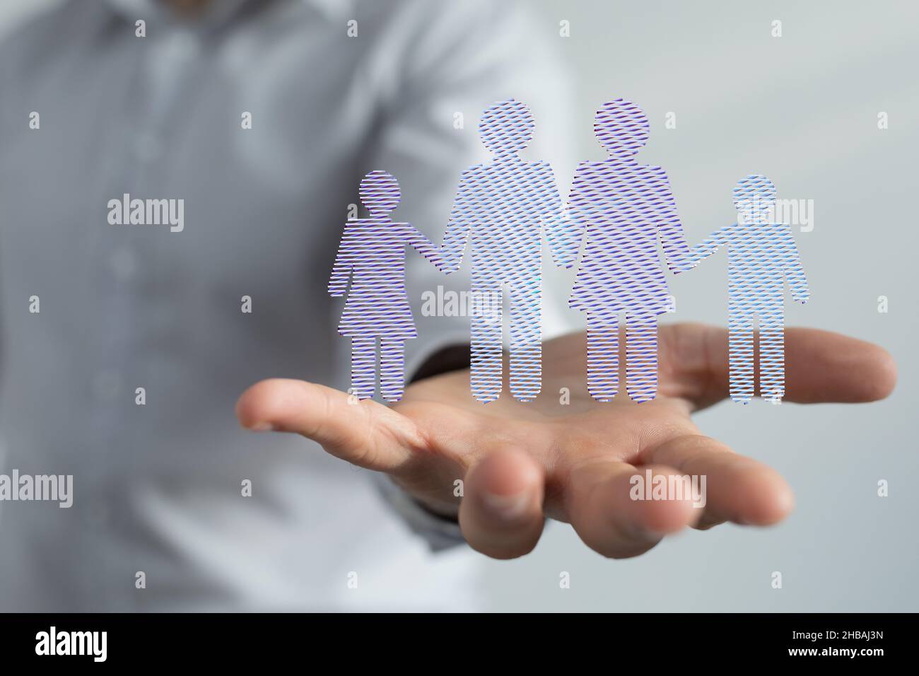3d rendered family members hovering over a man's hand Stock Photo - Alamy