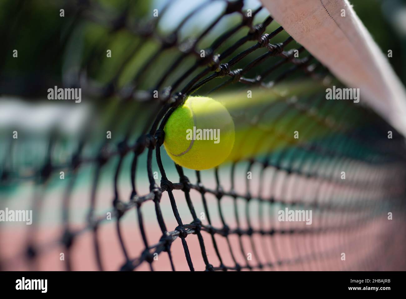 Tennis ball hits in the net during game Stock Photo Alamy