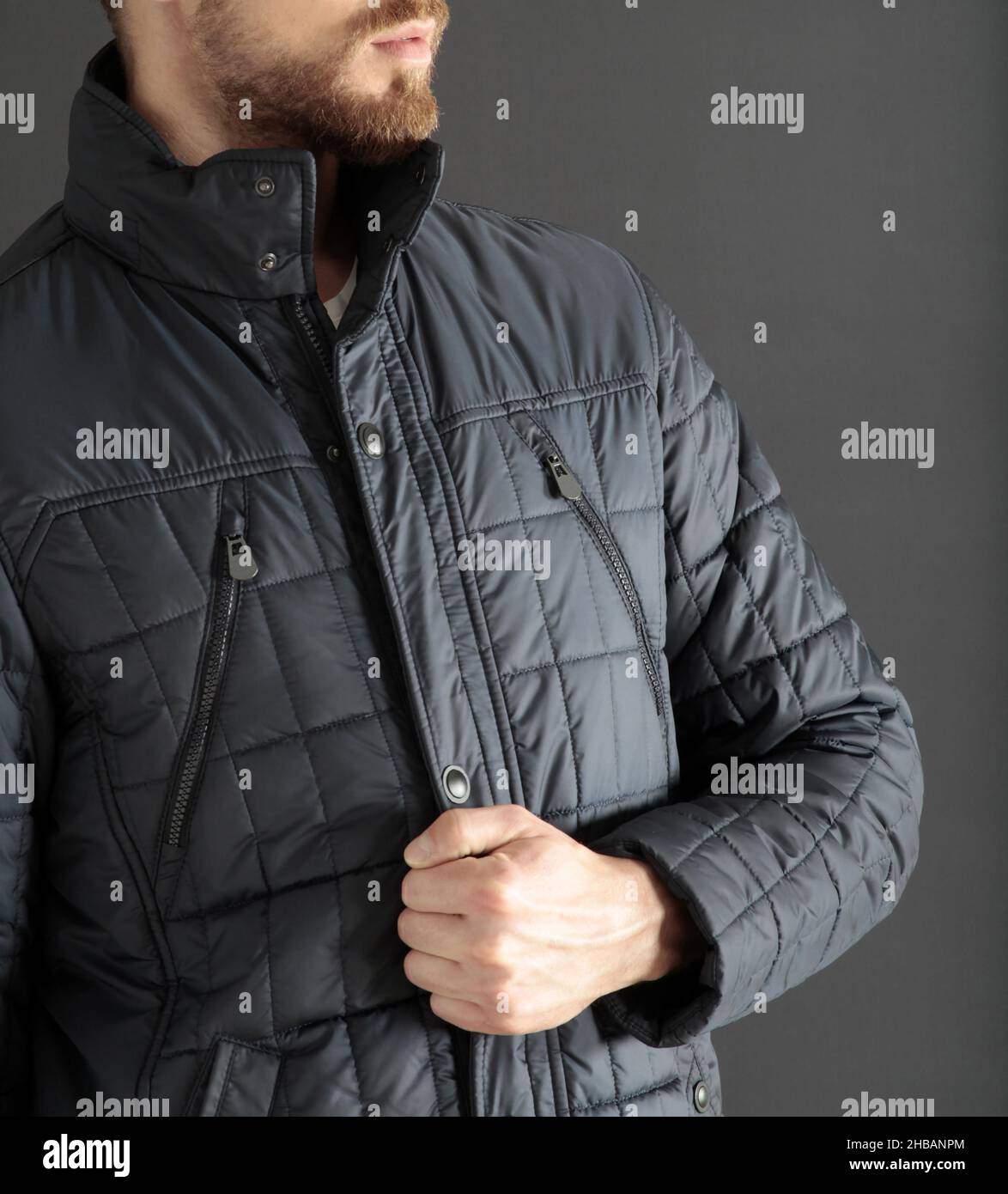 Navy blue down jacket. Men's clothing Stock Photo Alamy