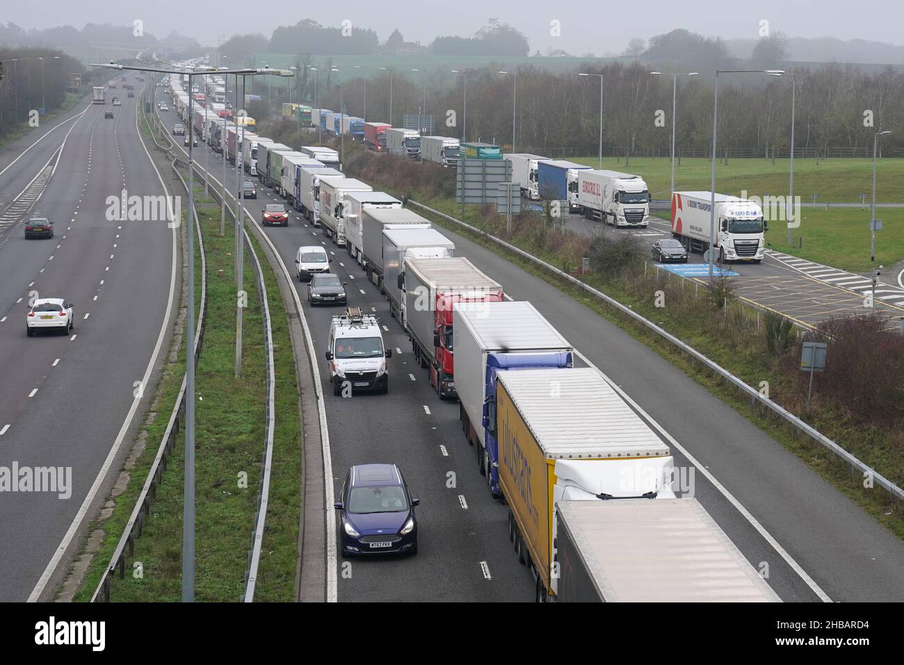 Freight lorries queuing on the M20 motorway in Kent heading to Dover at 11A the Channel Tunnel