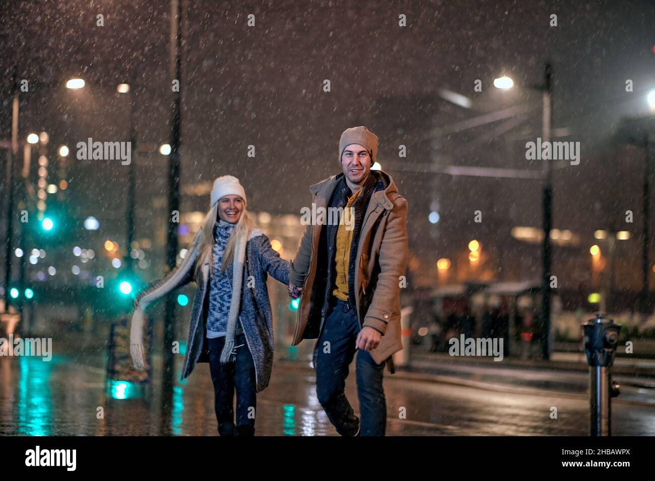 Lovely couple having fun outside on a winter night Stock Photo