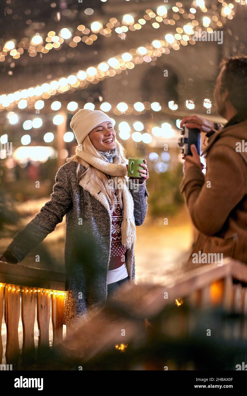 Happy caucasian couple exploring the city together; Holiday joy concept Stock Photo