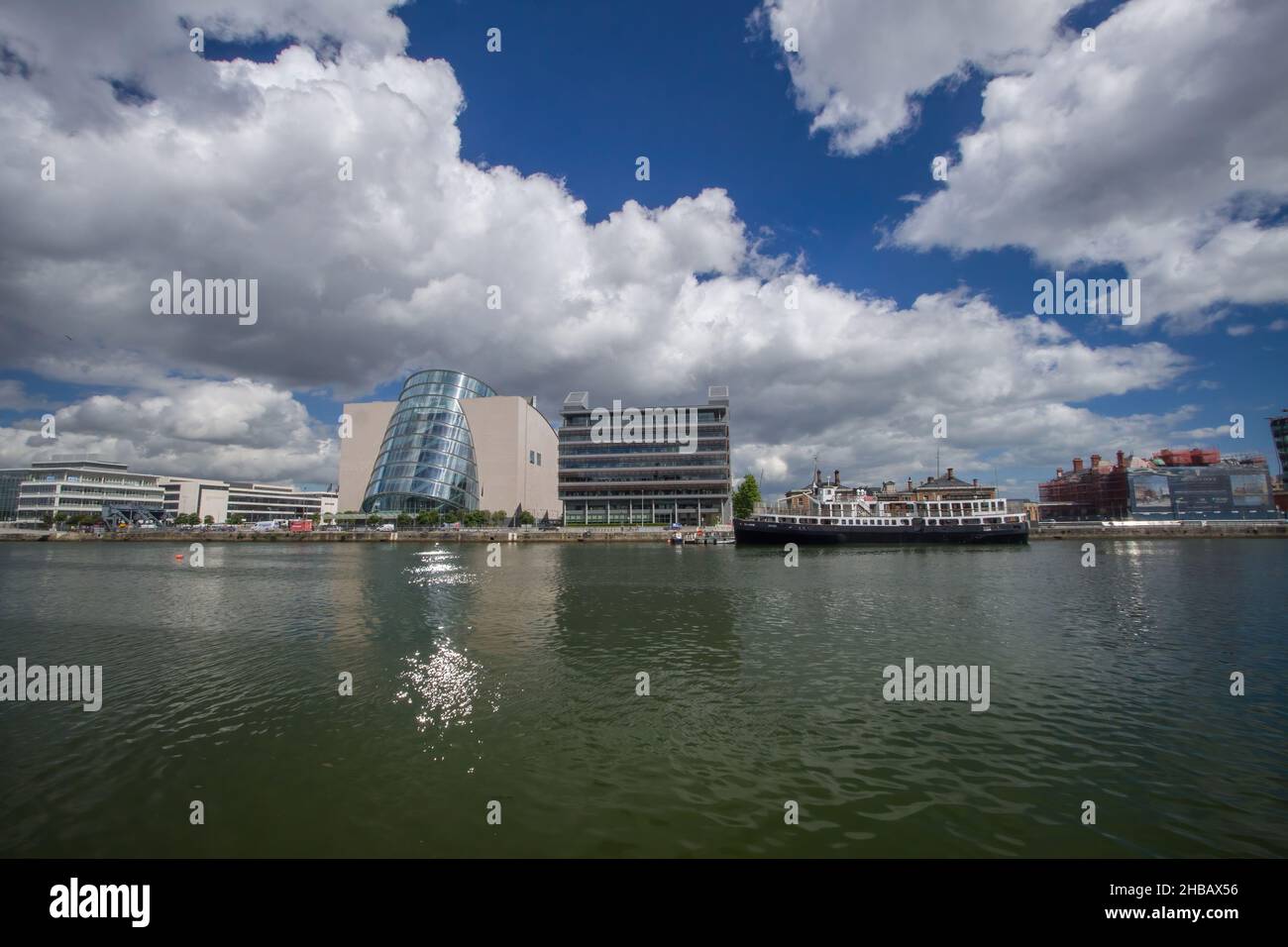 The Convention Centre Dublin, IFSC House and Cill Airne boat at City Quay harbor wharf, Dublin through the lens, urban and streets photography, Dublin Stock Photo