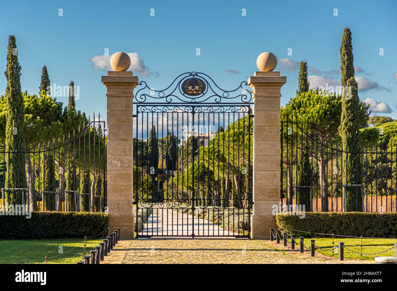 Entrance portal to the estate Château Léoube near Bormes-les-Mimosas, France. The access road of Chateau Leoube. The estate stretches four kilometers along the coast of the department of Var Stock Photo