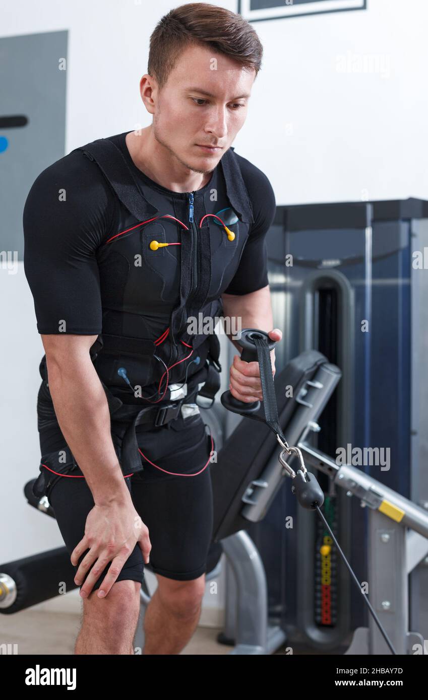 Young man performing full body EMS training Stock Photo Alamy
