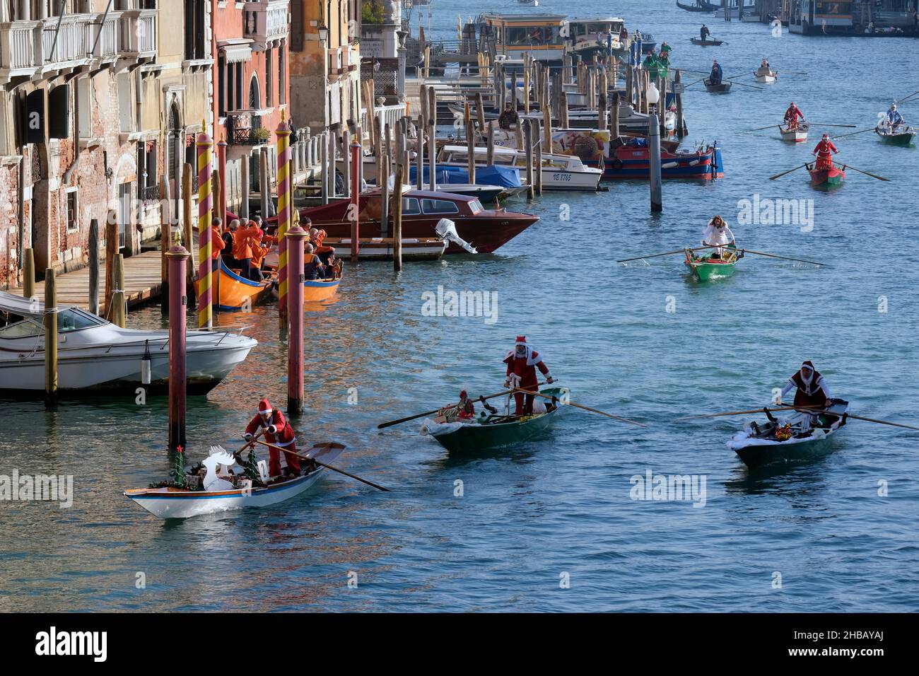 People dressed as Santa Claus row during a Christmas regatta in Venice, Italy December 17, 2017.(MvS) Stock Photo