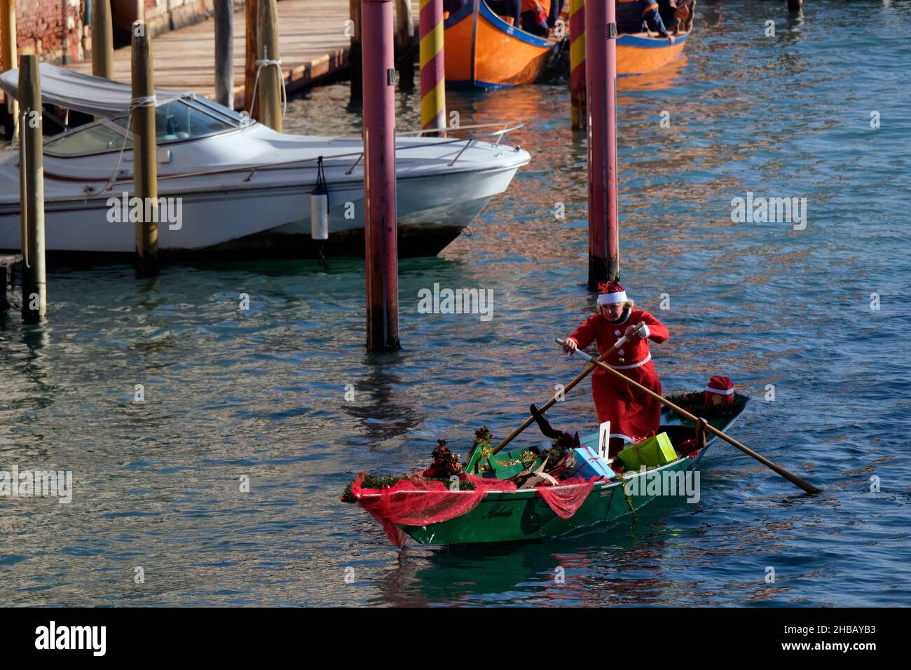 People dressed as Santa Claus row during a Christmas regatta in Venice, Italy December 17, 2017.(MvS) Stock Photo