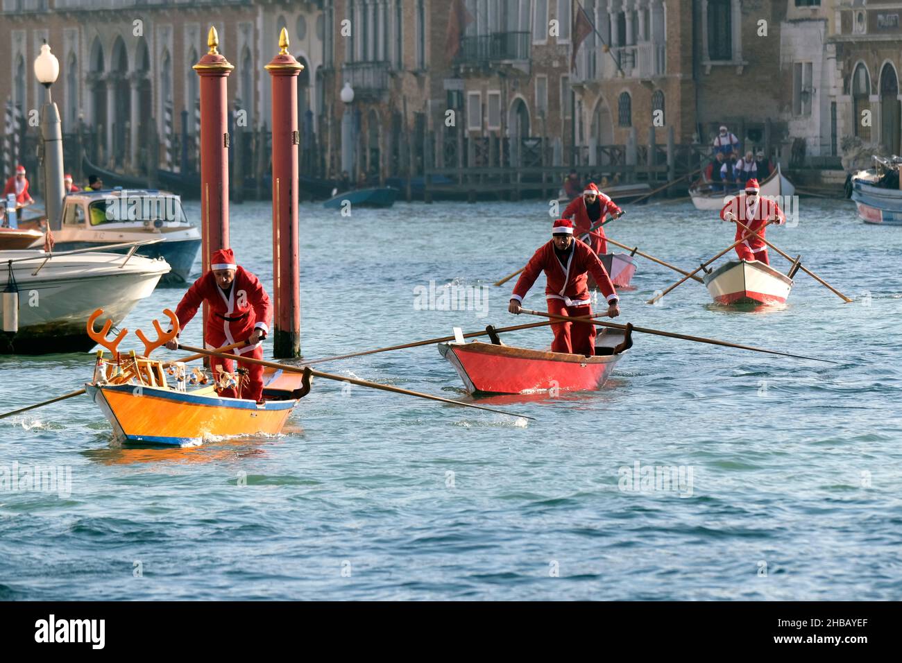 People dressed as Santa Claus row during a Christmas regatta in Venice, Italy December 17, 2017.(MvS) Stock Photo