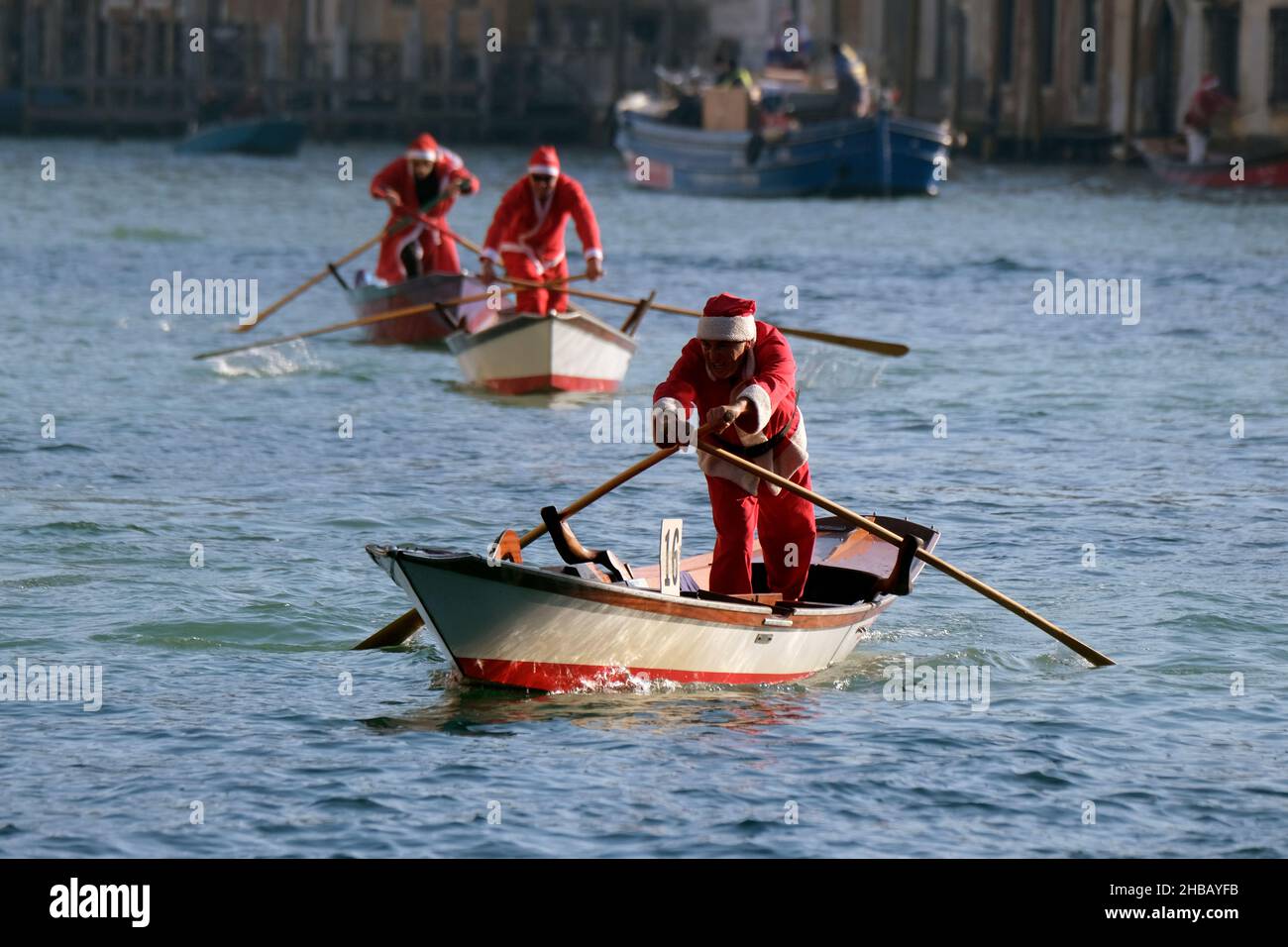 People dressed as Santa Claus row during a Christmas regatta in Venice, Italy December 17, 2017.(MvS) Stock Photo