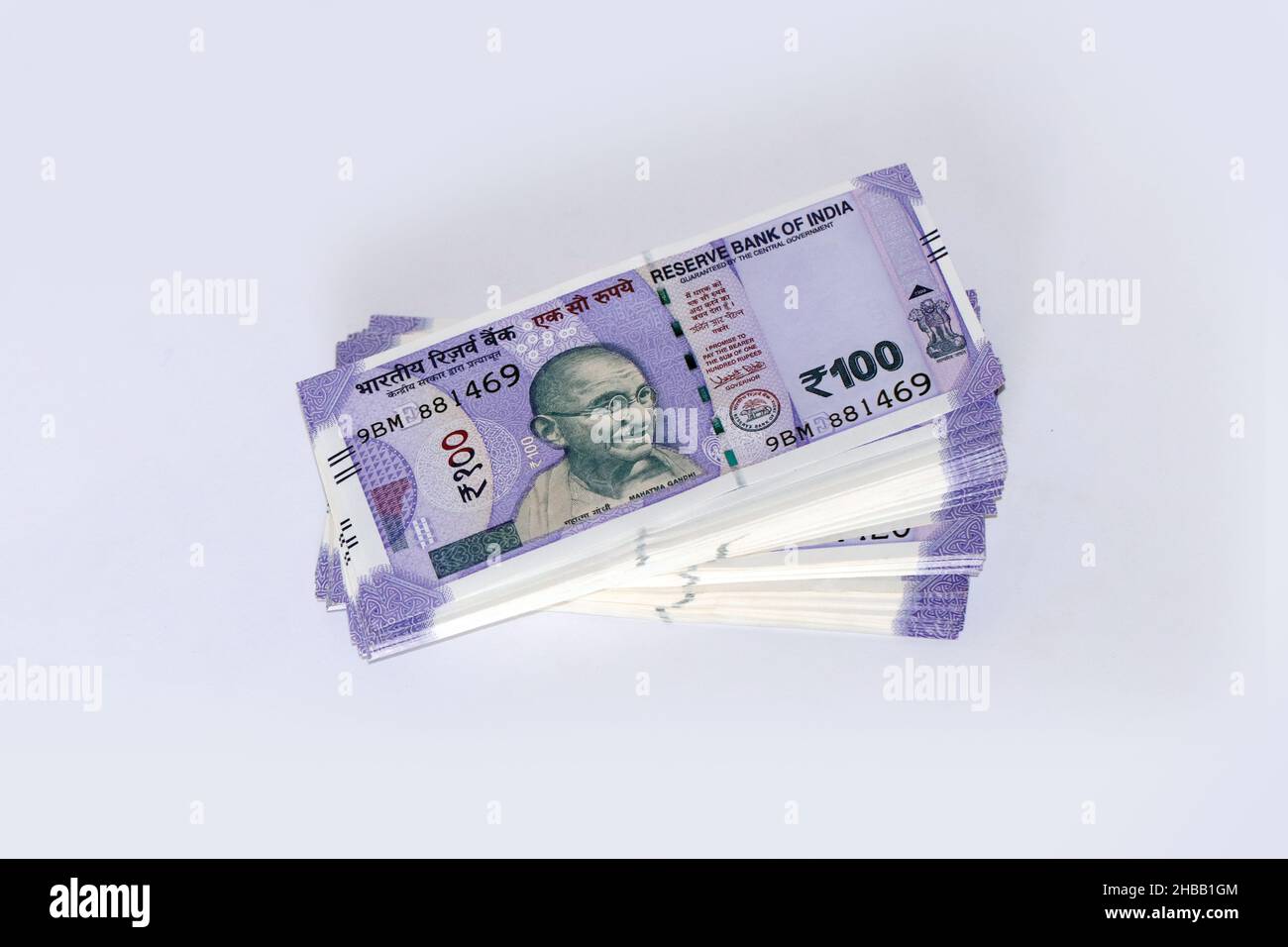 Stack of One hundred Indian rupee notes in white background, Indian currency bundle notes. Stock Photo