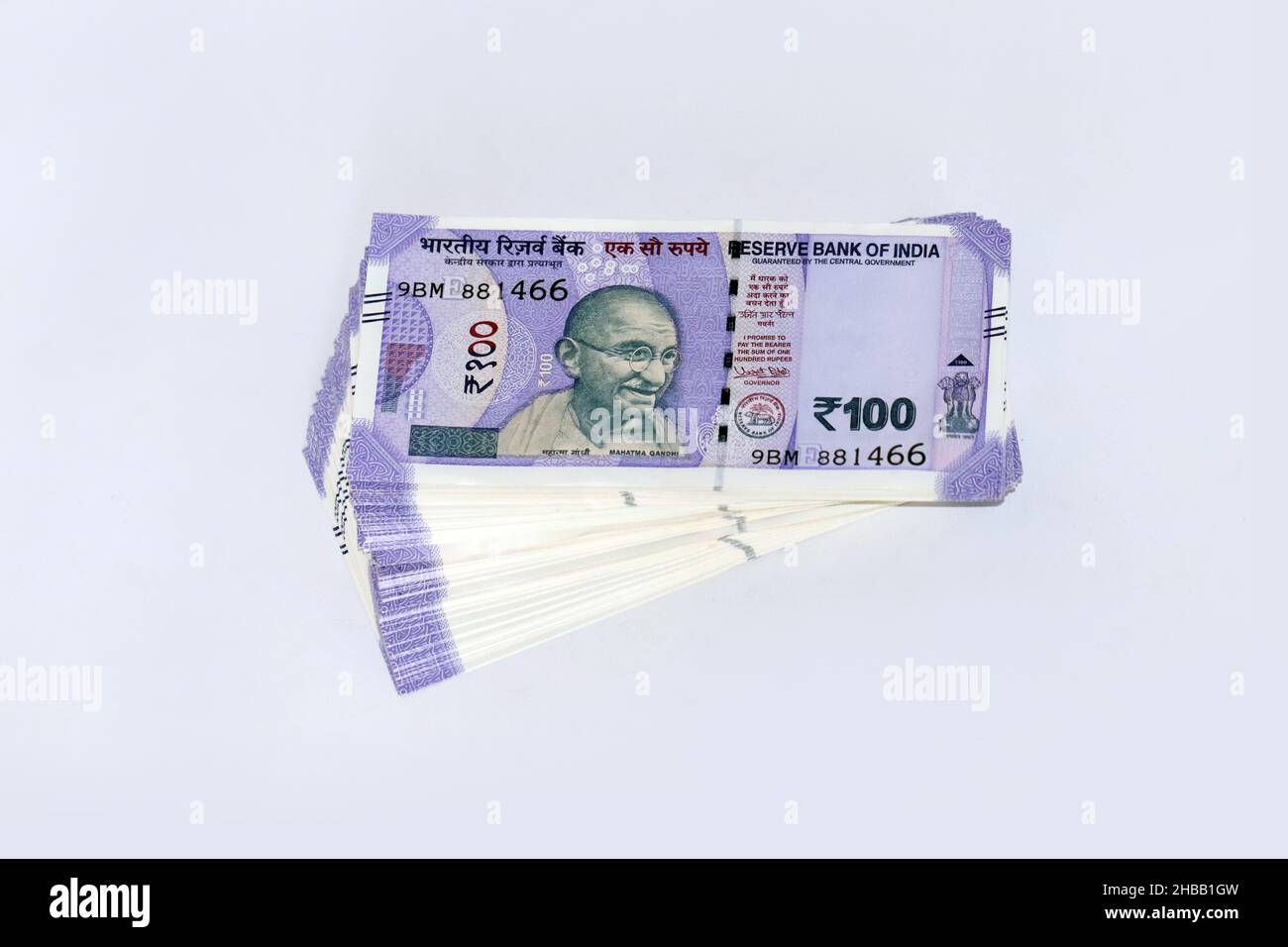 Stack of One hundred Indian rupee notes in white background, Indian currency bundle notes. Stock Photo