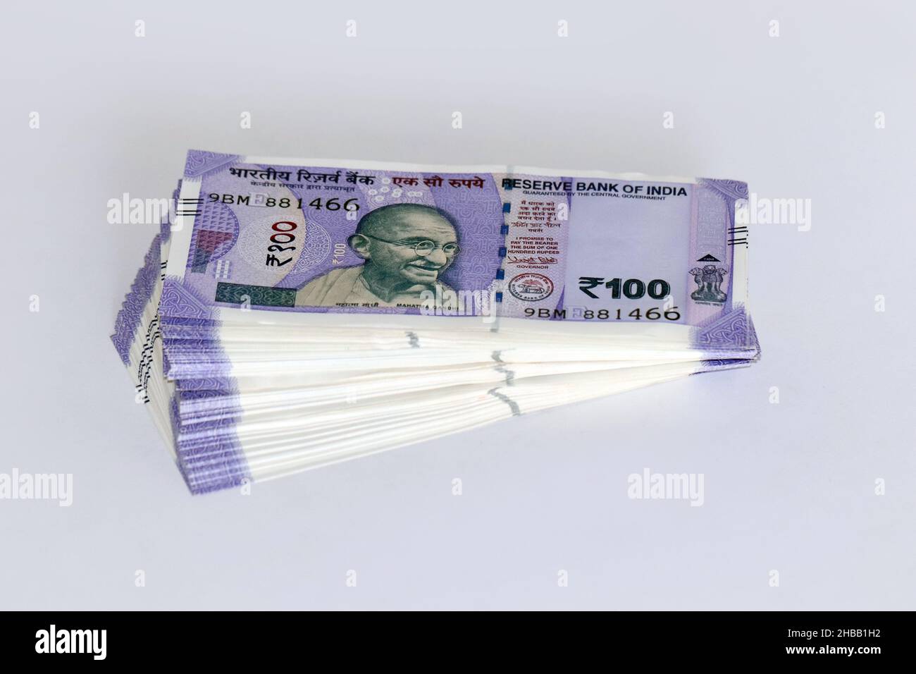 Stack of One hundred Indian rupee notes in white background, Indian currency bundle notes. Stock Photo