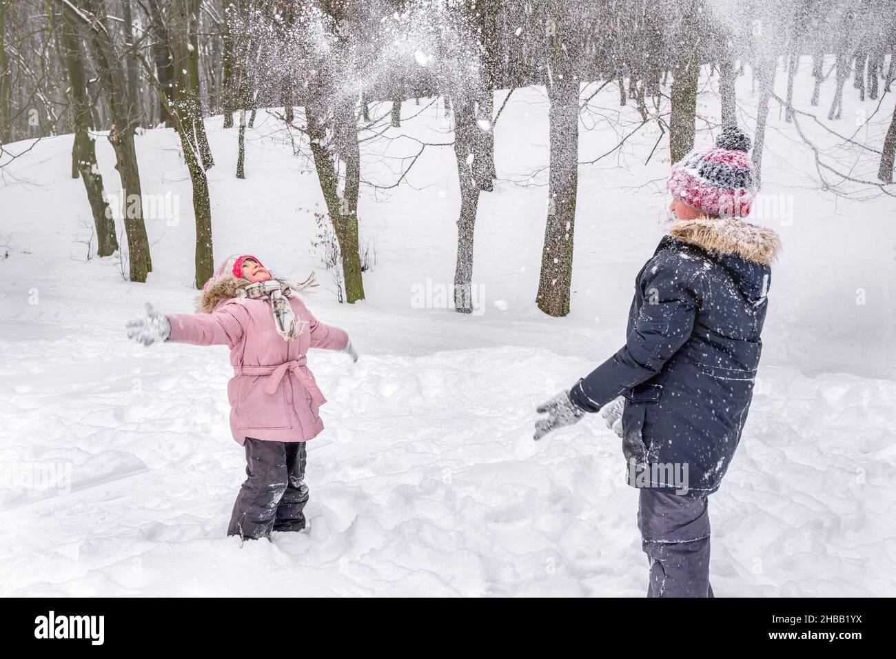 Children Wearing Snow Clothes In Winter Stock Photo - Download Image Now -  Brother, Child, Offspring - iStock