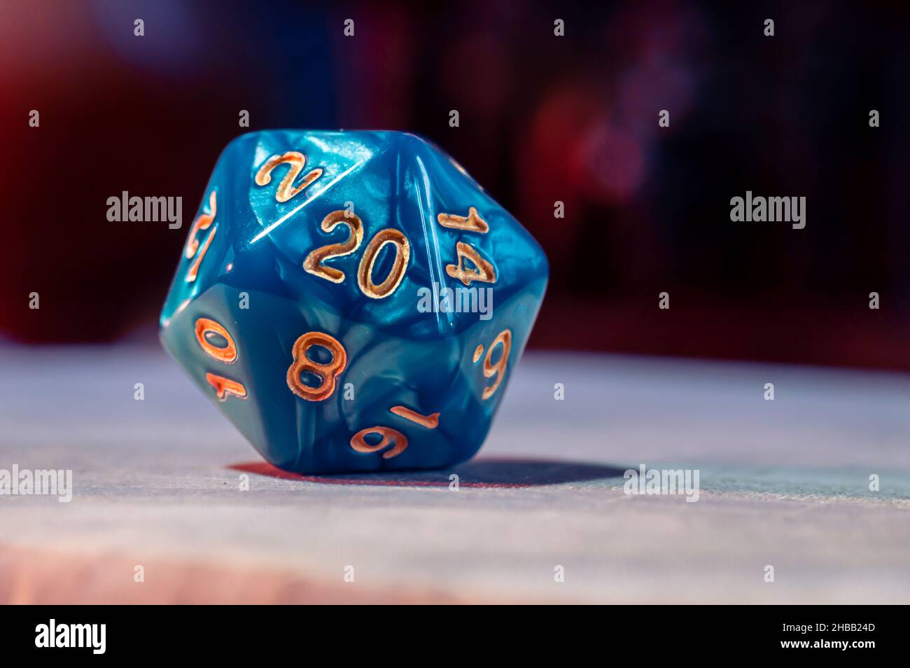 Close-up image of blue a role-playing gaming die with 20 sides. Stock Photo