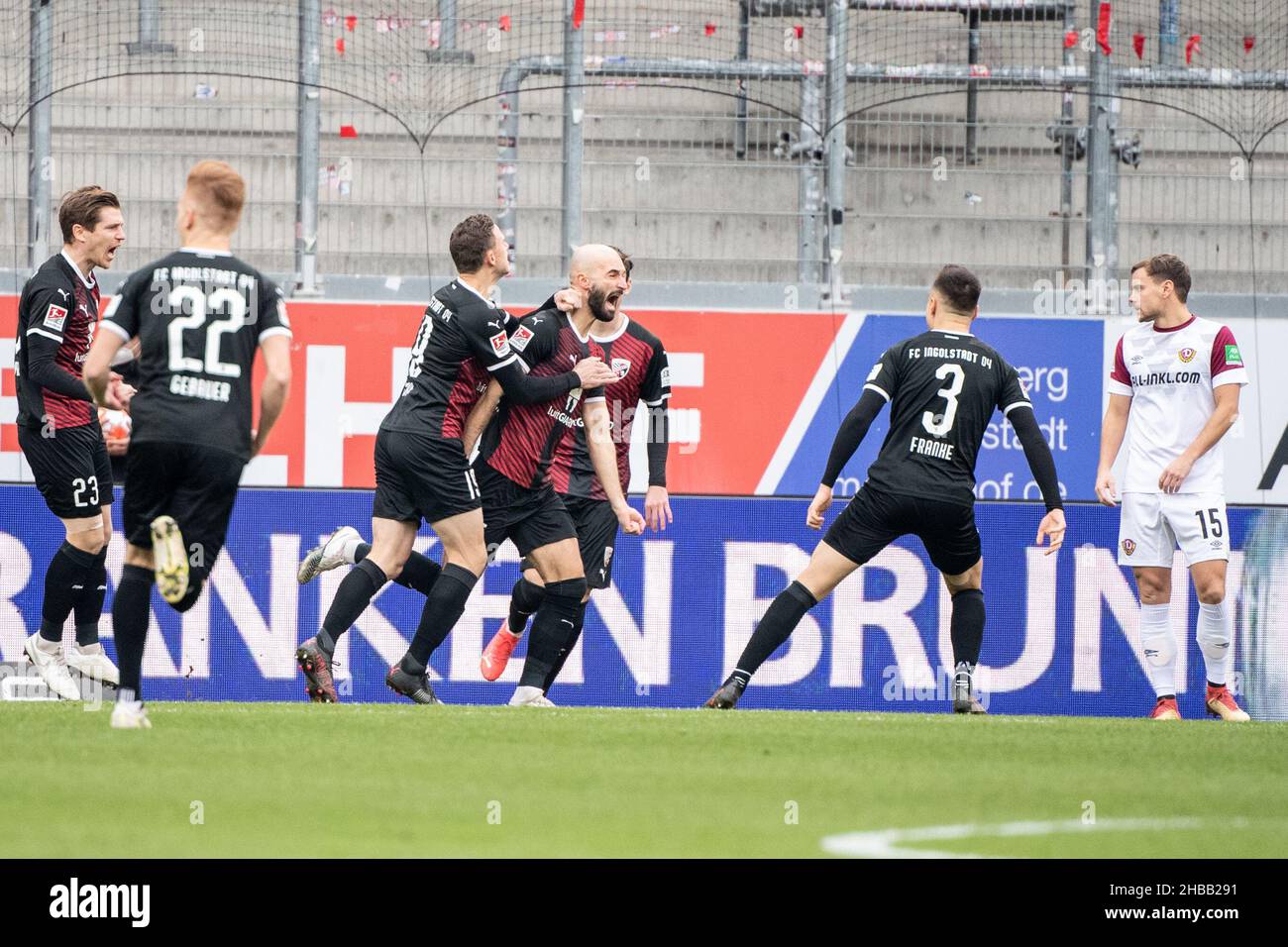 Ingolstadt, Germany. 18th Dec, 2021. Football: 2. Bundesliga, FC Ingolstadt 04 - Dynamo Dresden, Matchday 18, Audi Sportpark. Ingolstadt's Nico Antonitsch (centre) celebrates with his team-mates after scoring the 1:0 goal. Credit: Matthias Balk/dpa - IMPORTANT NOTE: In accordance with the regulations of the DFL Deutsche Fußball Liga and/or the DFB Deutscher Fußball-Bund, it is prohibited to use or have used photographs taken in the stadium and/or of the match in the form of sequence pictures and/or video-like photo series./dpa/Alamy Live News Stock Photo