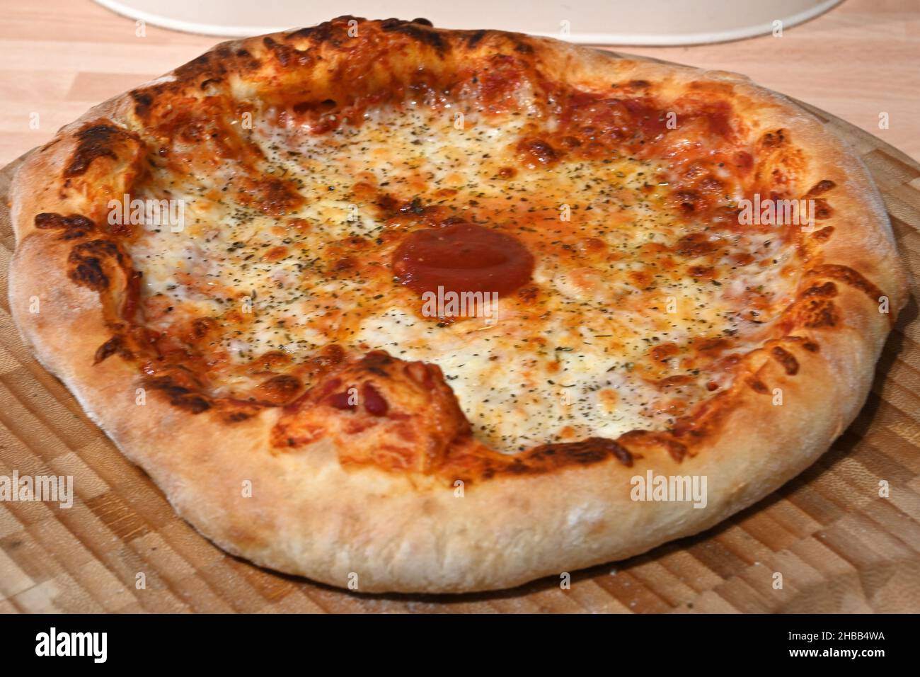 stone baked Neapolitan pizza cooked in a pizza oven Stock Photo