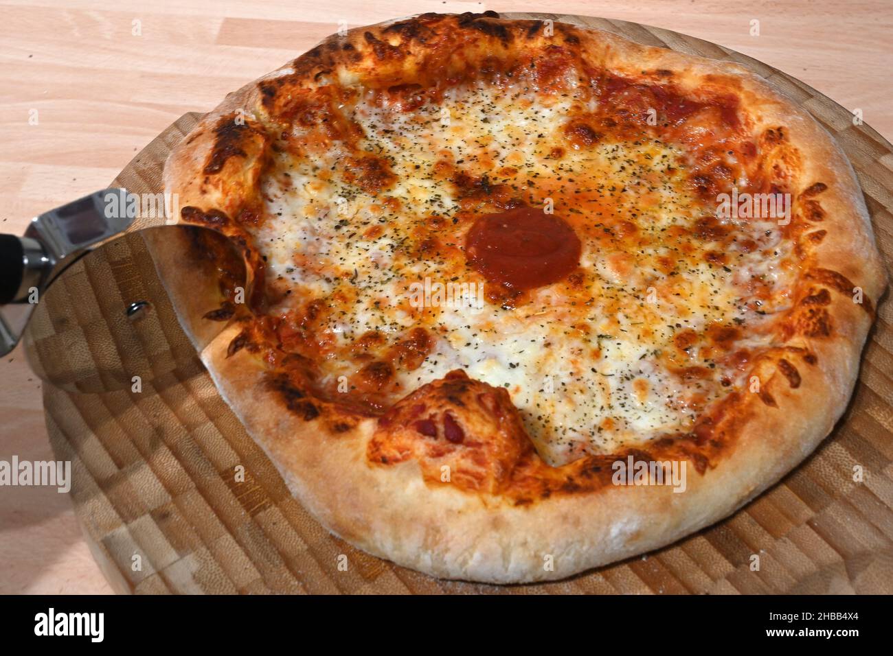 stone baked Neapolitan pizza cooked in a pizza oven Stock Photo