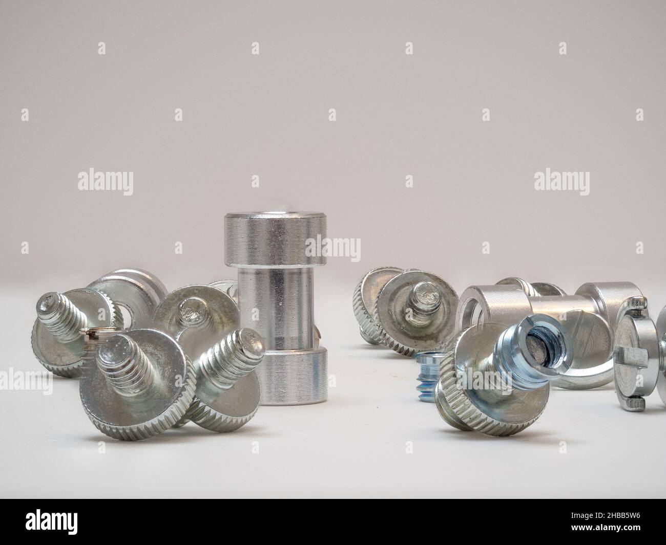 CNC machined aluminium bolts with screw threads and a bushing with