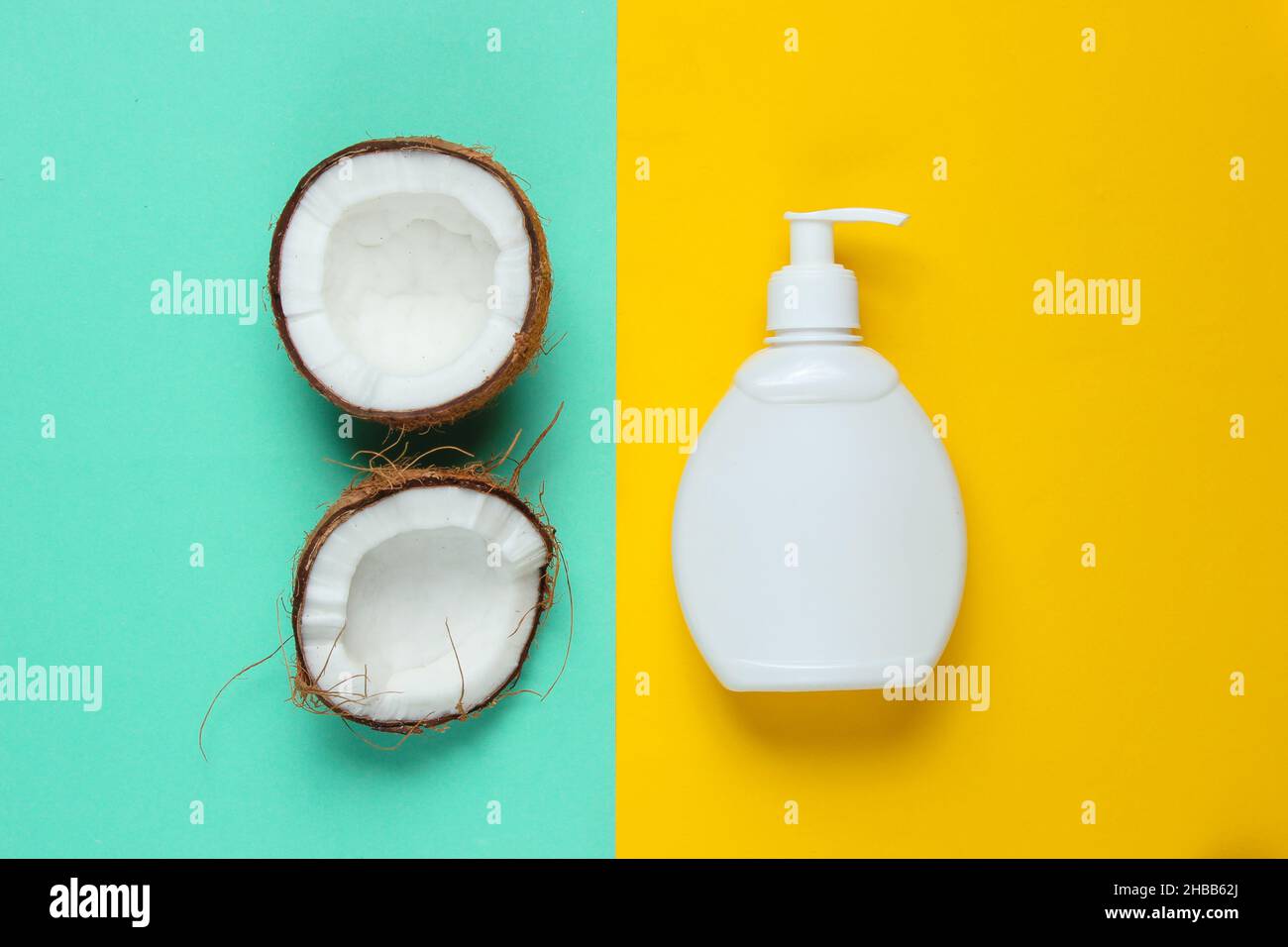 Coconut Shampoo. Shampoo bottle, coconut halves on a blueyellow pastel