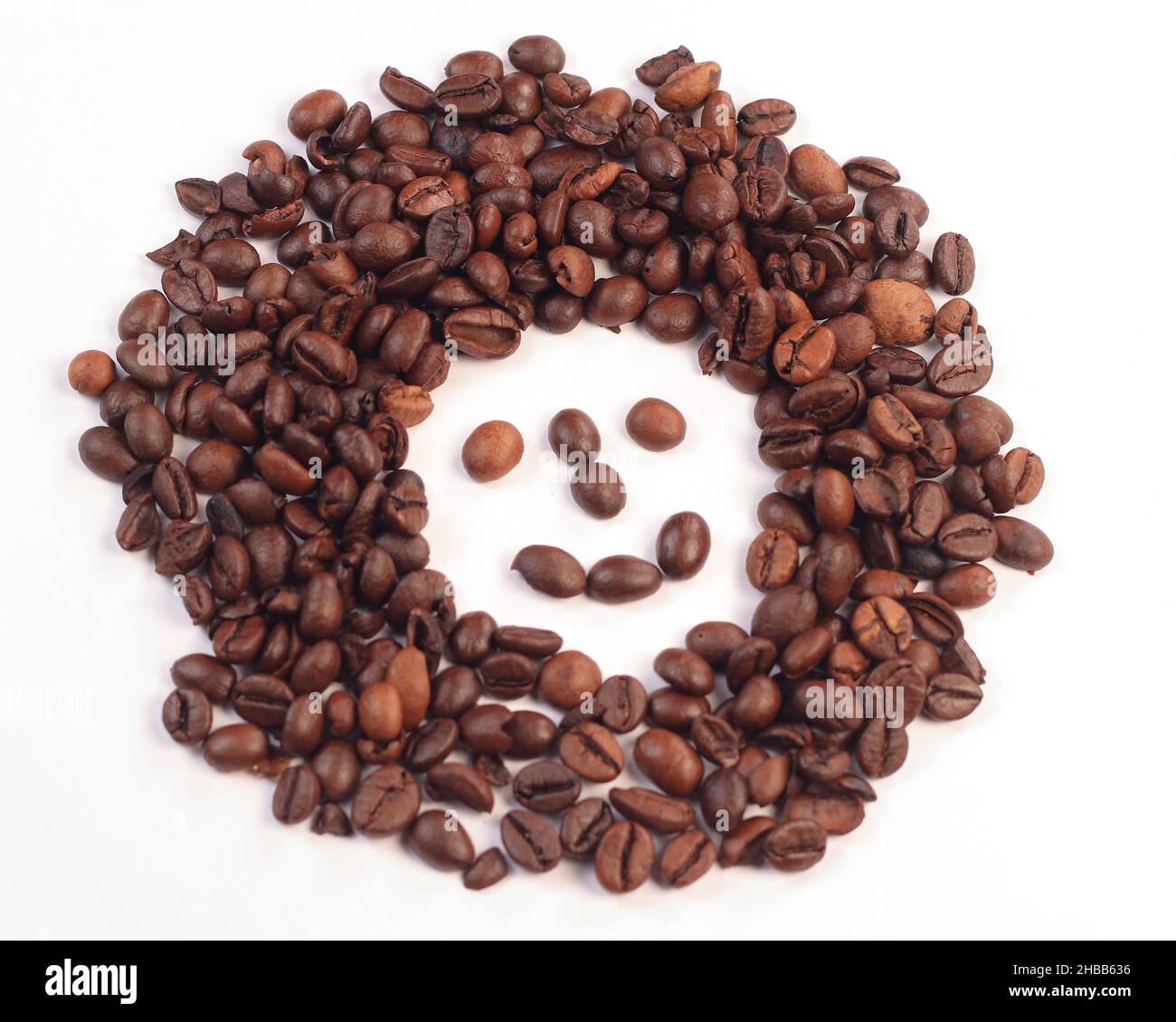 Smileys in coffee beans, a cheerful message from coffee beans. Stock Photo