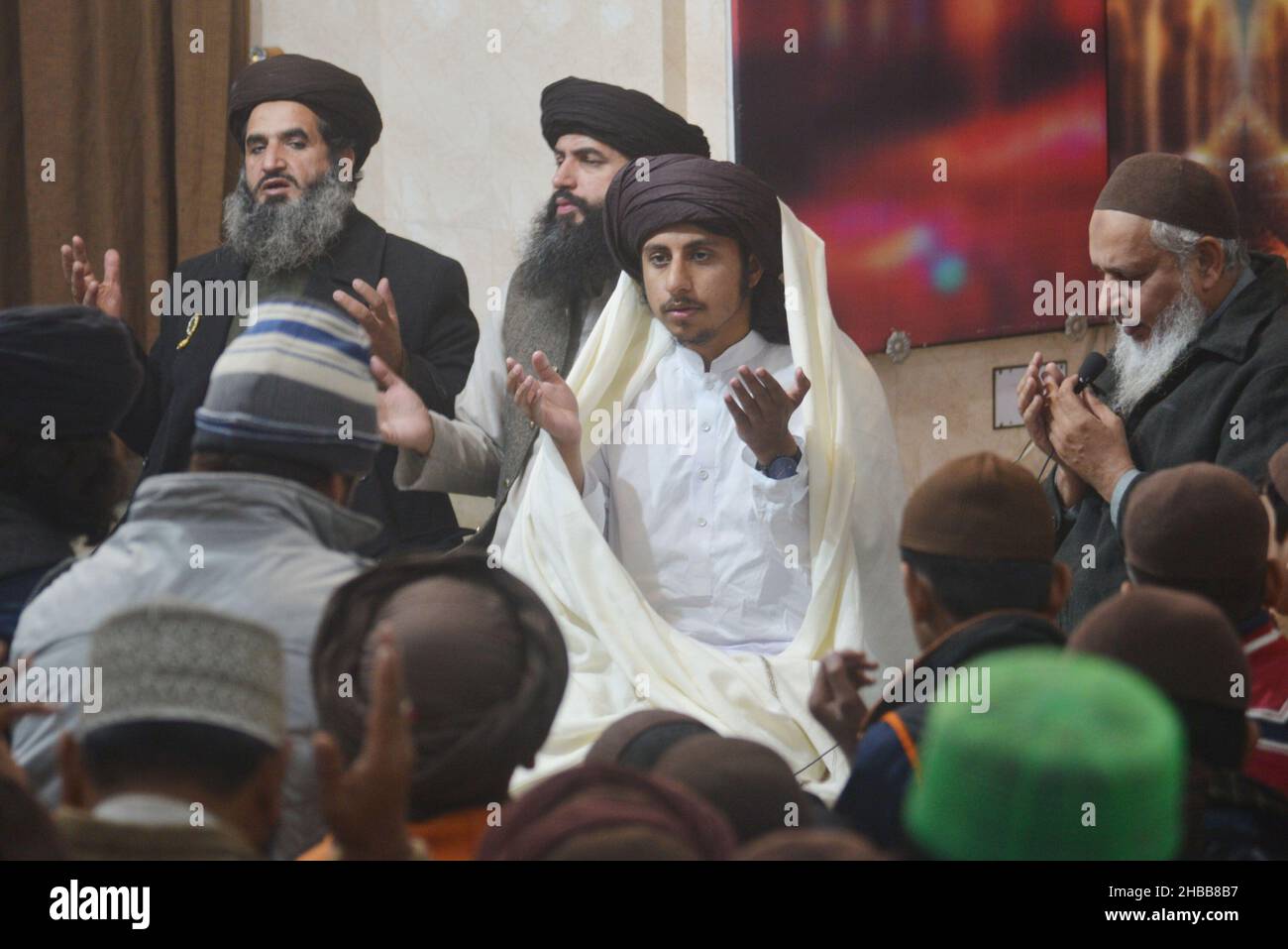 Lahore, Pakistan. 16th Dec, 2021. Leader of Tehreek Labbaik Pakistan (TLP) Hafiz Saad Hussain Rizvi, Hafiz Anas Hussain Rizvi and students recite the holy Quran, in memory of the Martyrs Teachers and Students of Army Public School (APS) Peshawar incident, at Masjid Rehmat ul lil Alameen, in Lahore, Pakistan, on December 16, 2021. The attack on the Army Public School (APS) took place in the city of Peshawar, where more than 150 students were killed in 2014. (Photo by Rana Sajid Hussain/Pacific Press/Sipa USA) Credit: Sipa USA/Alamy Live News Stock Photo
