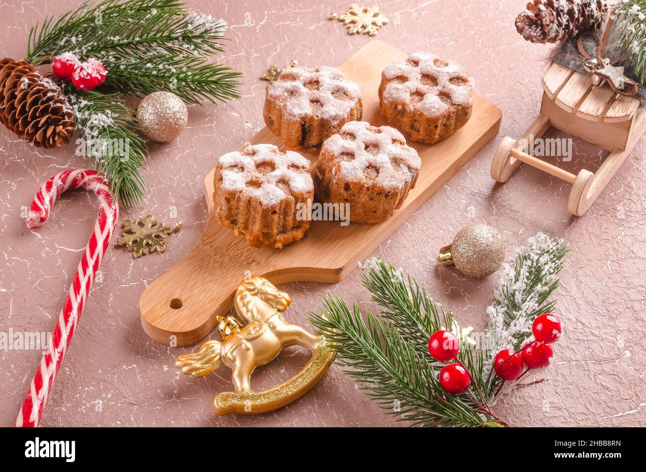 Christmas festive baked goods and christmas decorations on a beige