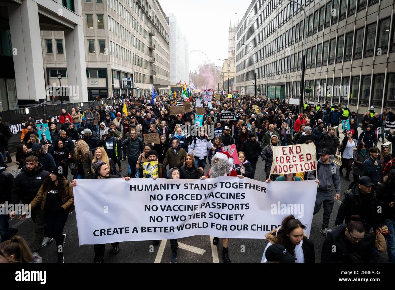 London, UK. 18th Dec, 2021. Protesters march through the city. Thousands of people come out to protest against the latest COVID19 restrictions. Protesters unite for freedom and march through the city to show the government that they do not have faith in their leadership. Credit: Andy Barton/Alamy Live News Stock Photo