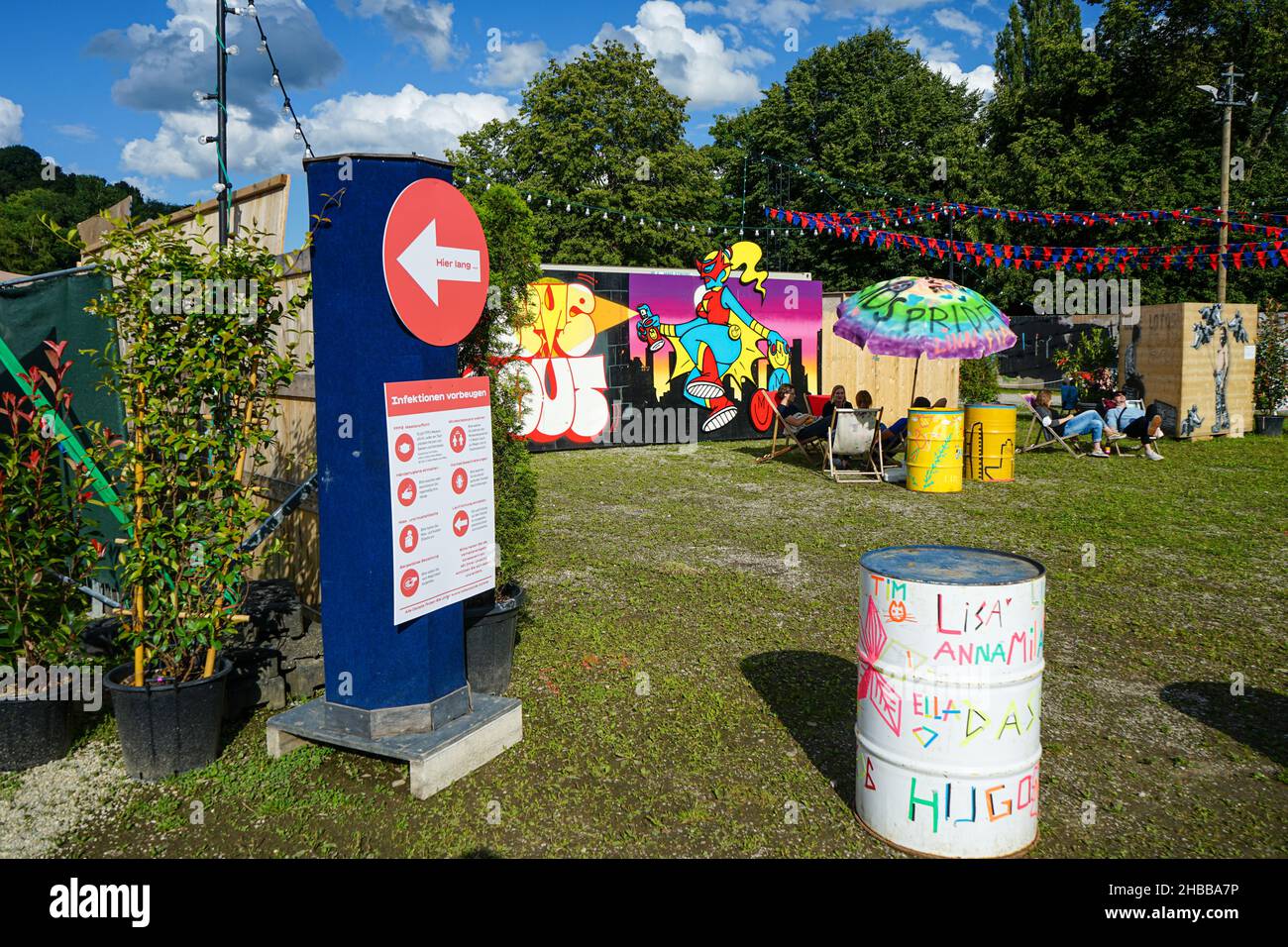 Sign about preventing infections during the Corona Pandemic on the Tollwood grounds in Munich. Stock Photo