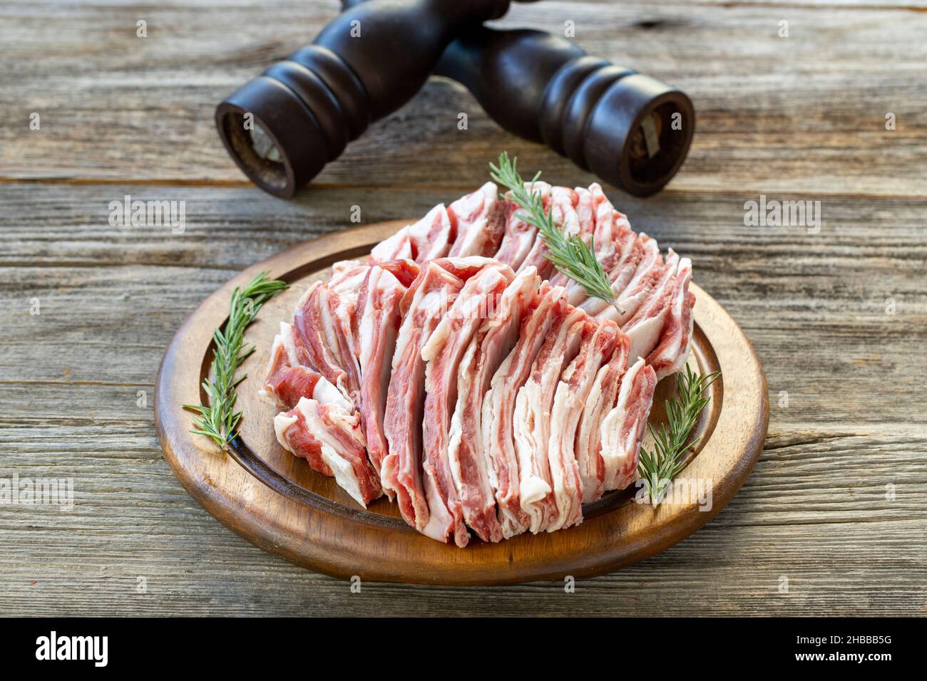 Raw lamb ribs on wood background.Spices and lamb ribs closeup. Horizontal view Stock Photo Alamy