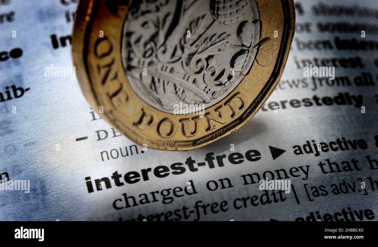 DICTIONARY DEFINITION OF THE WORDS INTEREST FREE WITH ONE POUND COIN RE MORTGAGES ECONOMY HOUSEHOLD BILLS ETC UK Stock Photo