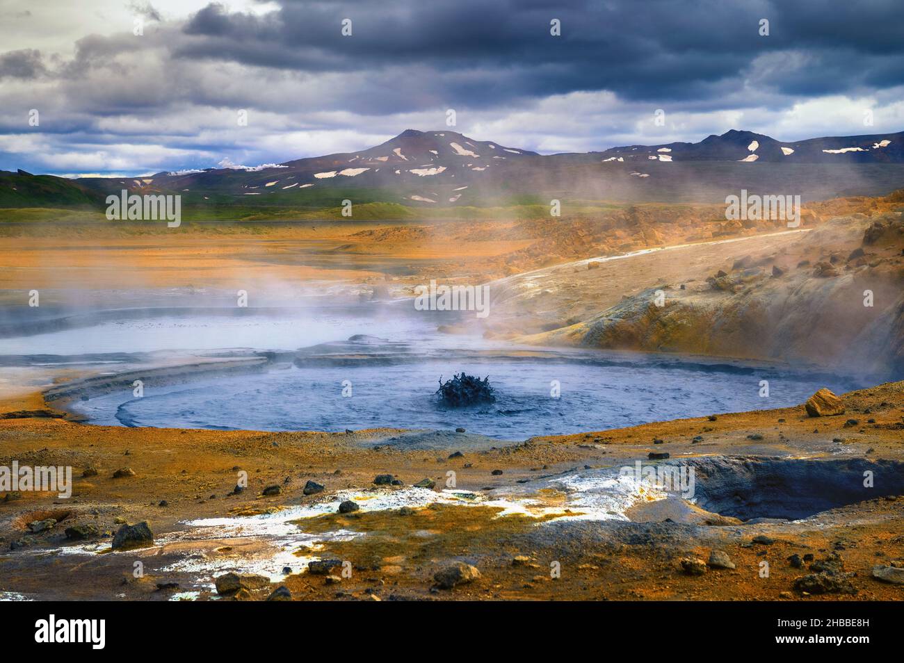 Steaming and bubbling mud pool in the Hverir geothermal area in Iceland Stock Photo