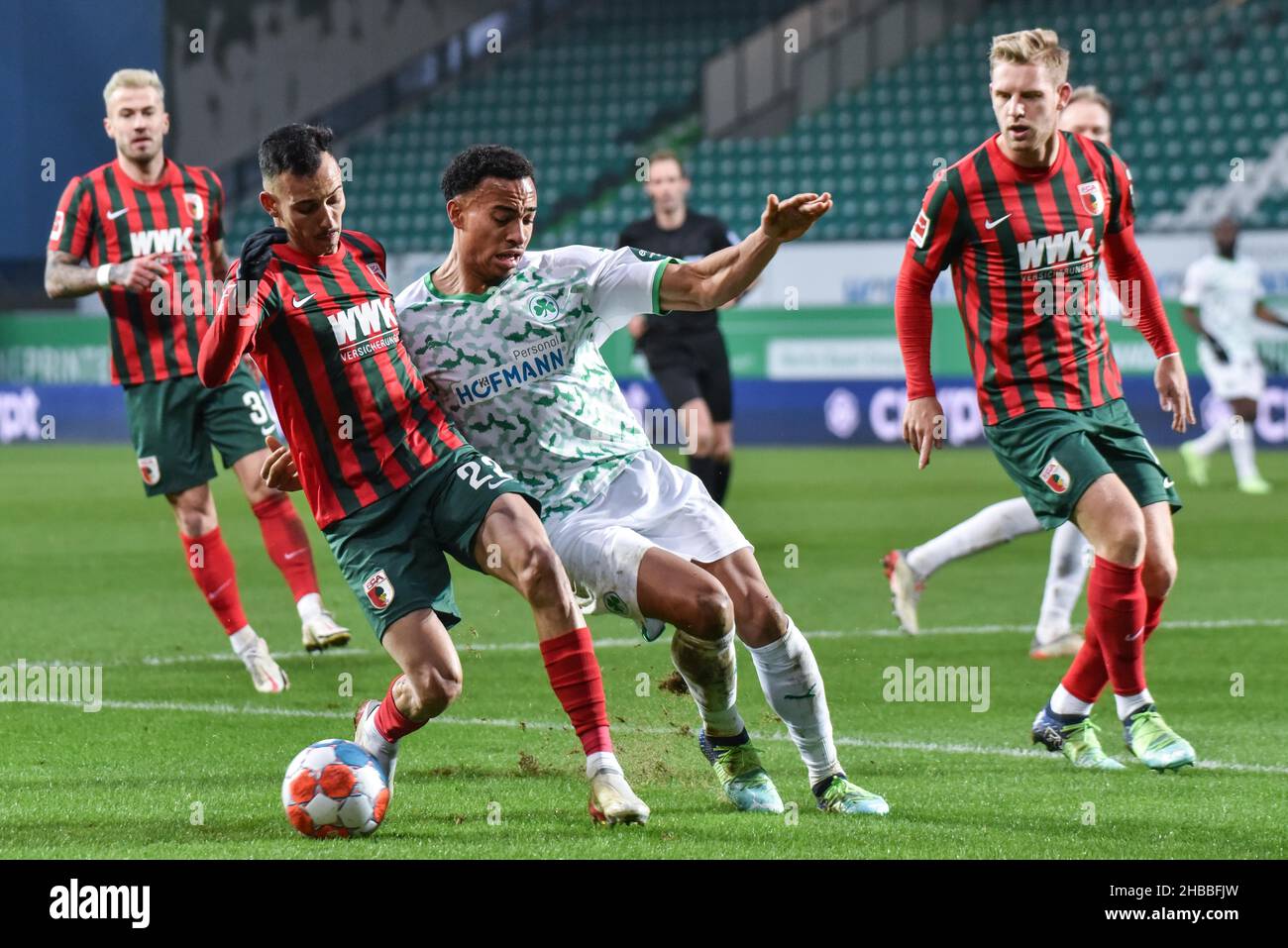 Fuerth, Germany. 18th Dec, 2021.  Fussball, 1.Bundesliga - SpVgg Greuther Fuerth vs. FC Augsburg  Image: (fLTR) Amaral Borduchi Lago (FC Augsburg, 22), Jamie Leweling (SpVgg Greuther Fürth,40)  DFL regulations prohibit any use of photographs as image sequences and or quasi-video Credit: Ryan Evans/Alamy Live News Stock Photo