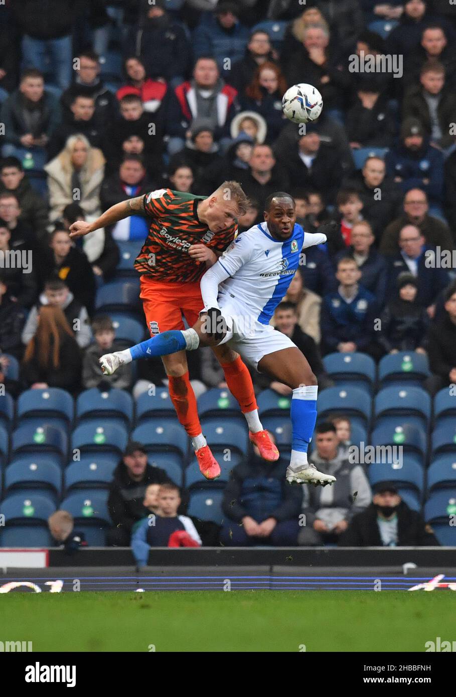 Birmingham City's Kristian Pedersen (left) and Blackburn Rovers' Ryan Nyambe battle for the ball during the Sky Bet Championship match at Ewood Park, Blackburn. Picture date: Saturday December 18, 2021. Stock Photo